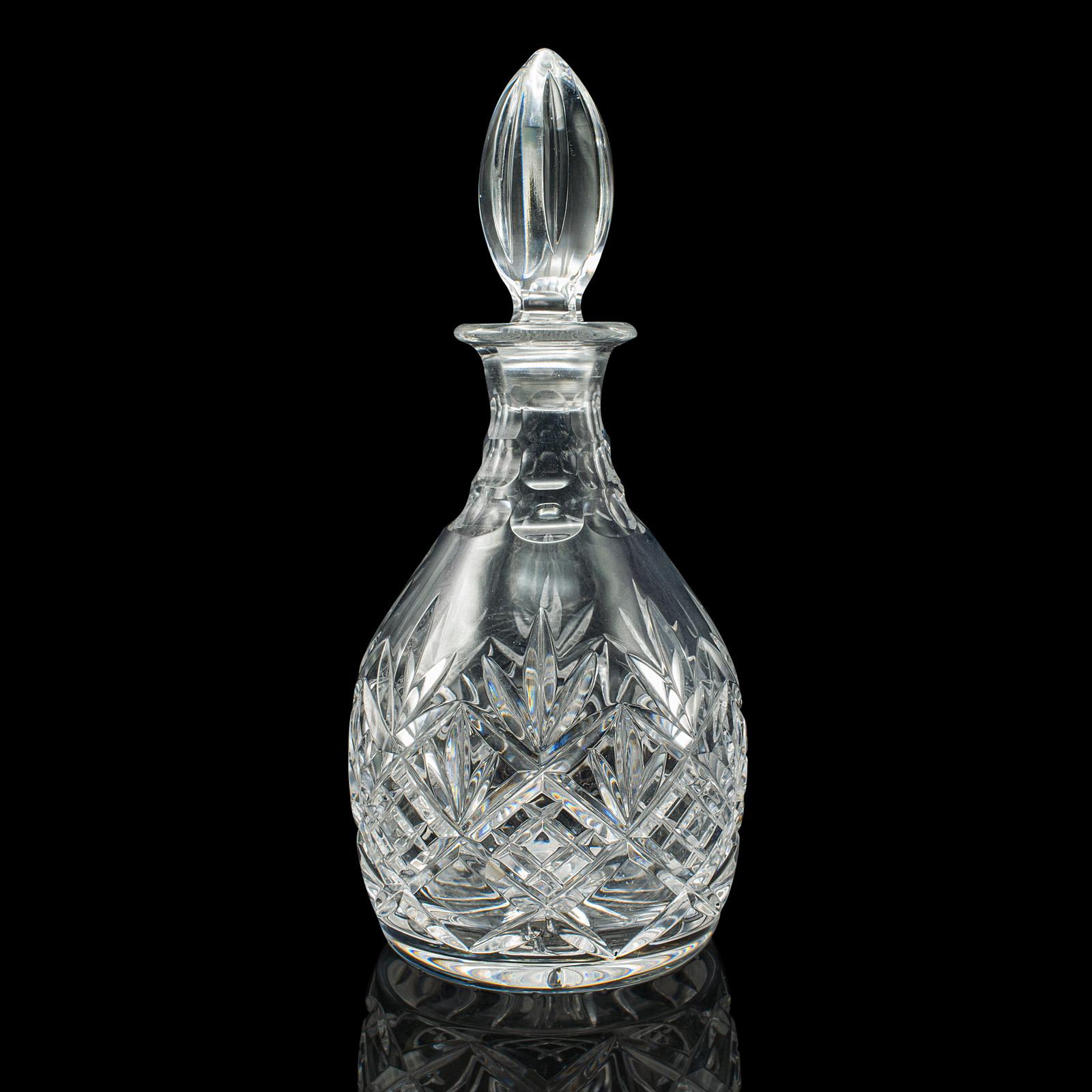 
This is a vintage crystal brandy decanter. An English, cut glass spirit vessel, dating to the mid 20th century, circa 1960.

Striking decanter with a superb, distinctive stopper
Displays a desirable aged patina and in good order
Cut crystal glass