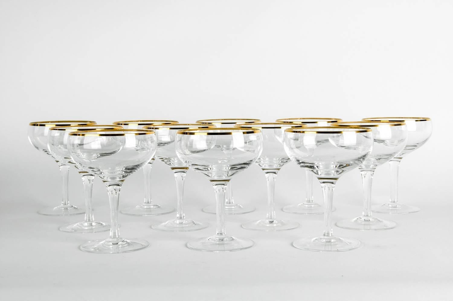 Vintage crystal champagne coupe glassware with gold trimmed top. Each glass is in excellent condition. Each glass coupe measure 5 inches high x 3.5 inches top diameter.
