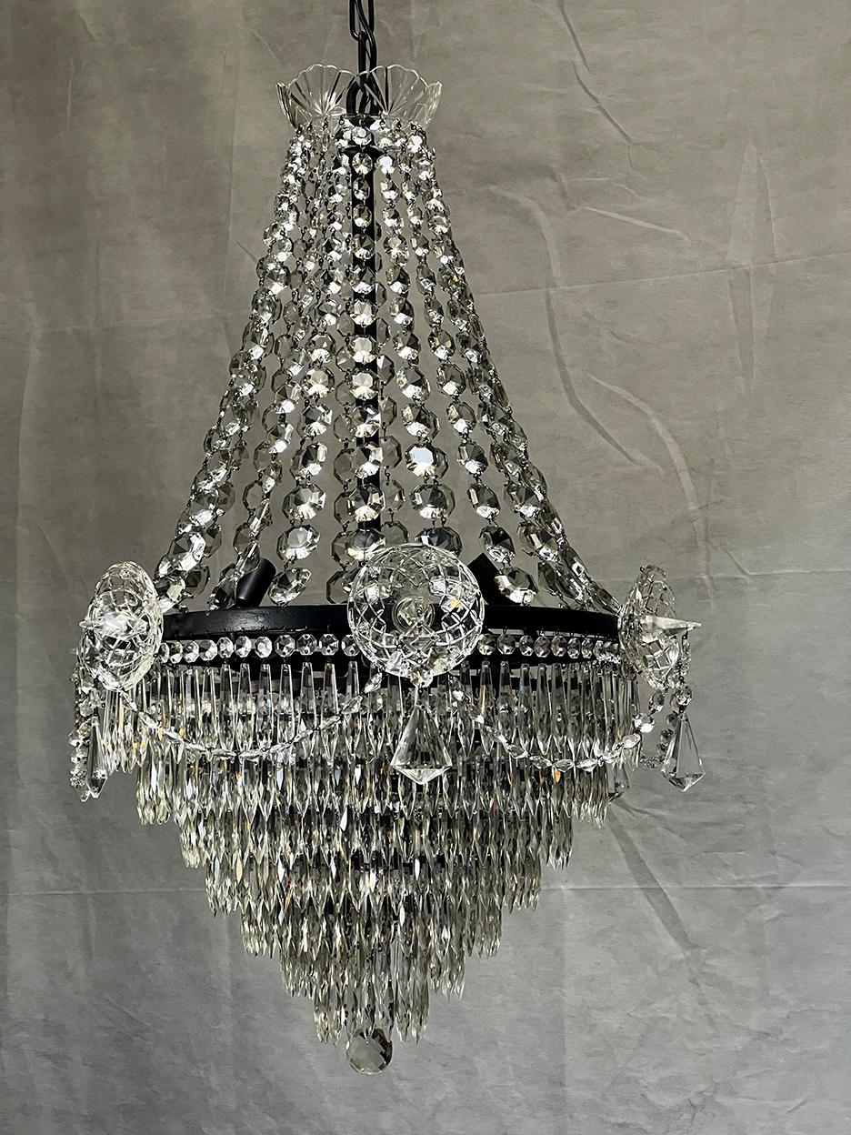 Painstakingly restored vintage chandelier. Every crystal removed and cleaned. All six sockets replaced with UL candelabra by a professional light restorer.
The side crsytel spires are quite unique, and catch the attention of just about all who enter