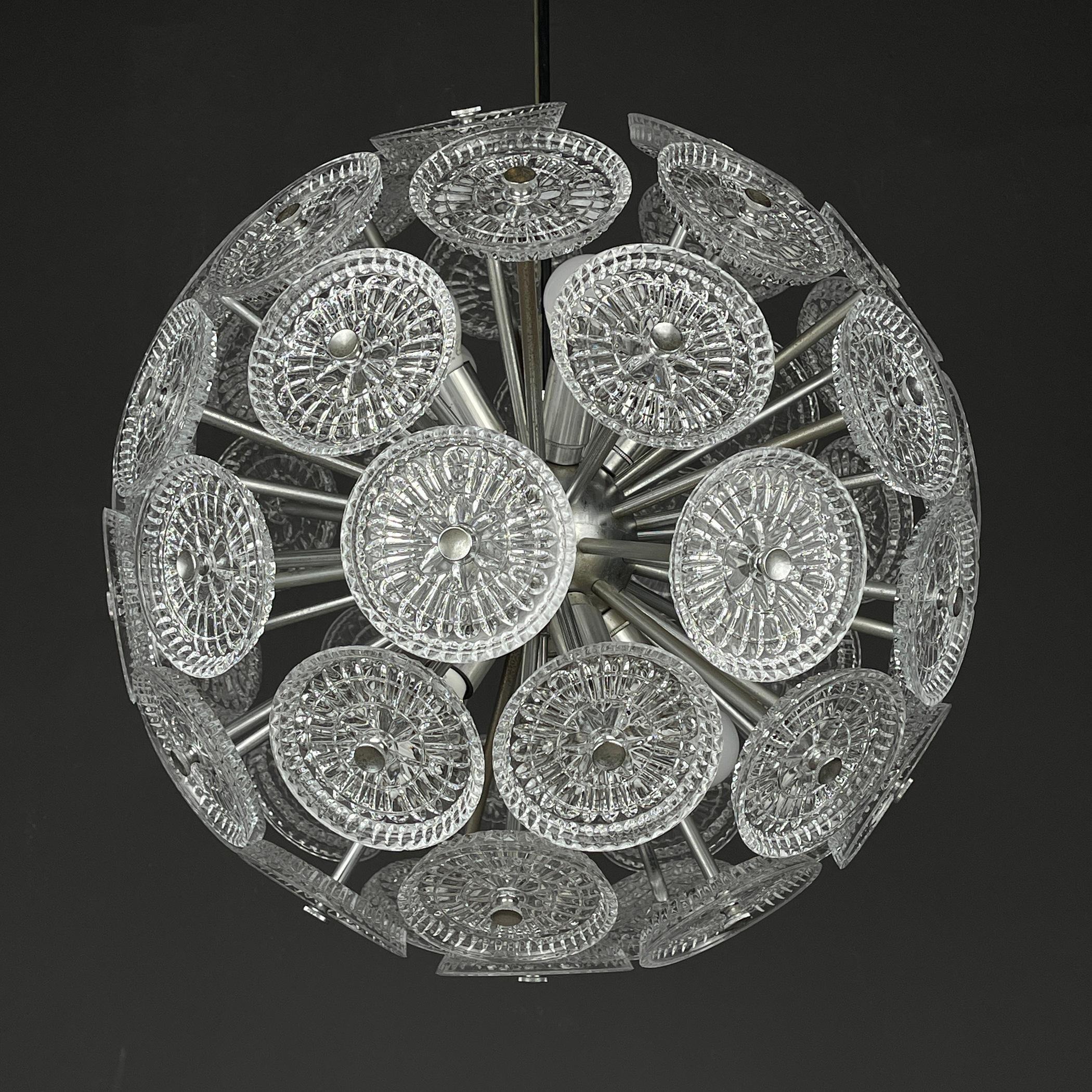Unique vintage crystal chandelier Sputnik Dandelion made in Italy in the 1960s.
The metal base and 51 glass elements. The chandelier has a simple, clean design that makes it the perfect choice to decorate and illuminate any room of the house in a