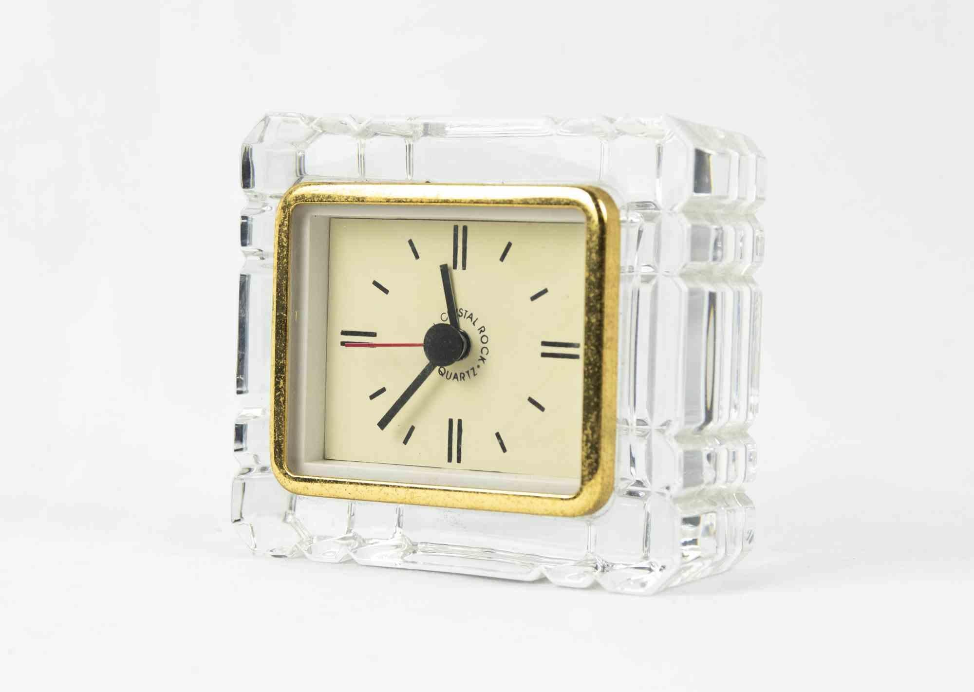 Vintage Clock is an original decorative object realized in the 1970s.

Original vintage clock made in crystal and brass. 

Made in Italy.

Dimensions: 10 x 4.5 cm. 

Good Conditions.
  