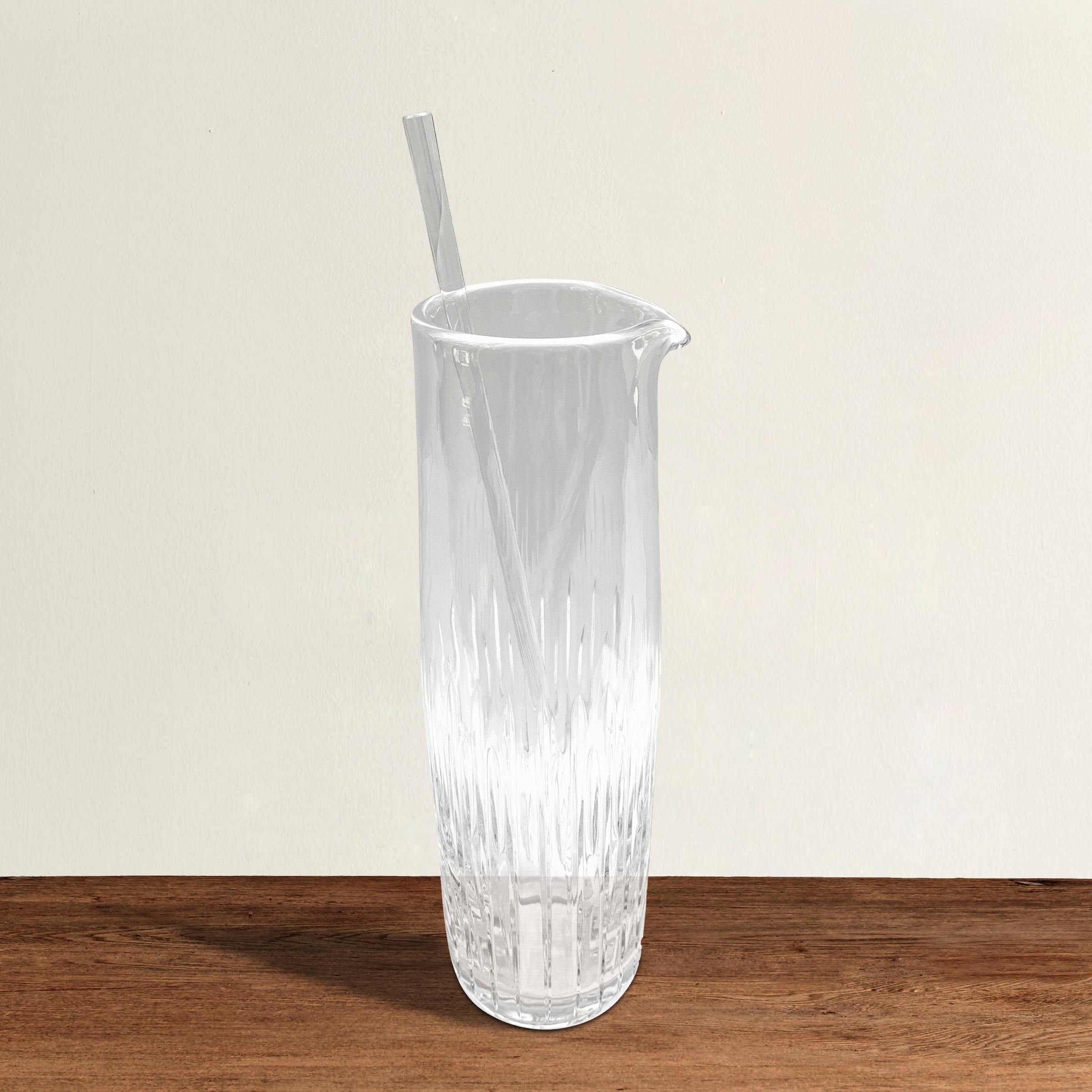 A beautiful vintage cut crystal cocktail pitcher with a beautiful elongated form with cut sides and a crystal stir stick. Marked, 