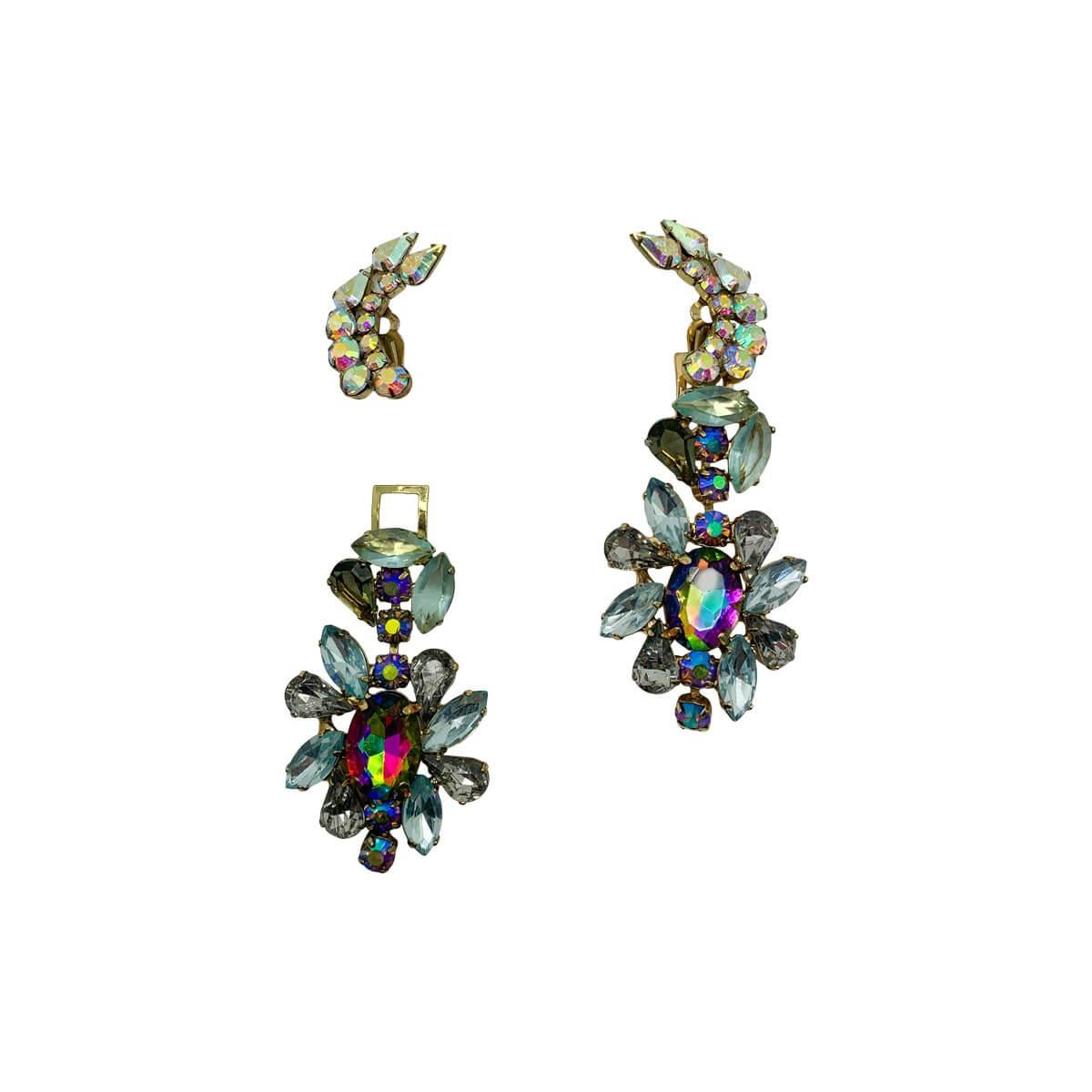 Uber cool and glamorous vintage kaleidoscope earrings. Featuring a day to night design so you can wow with a clip or a statement look. 
Vintage Condition: Very good without damage or noteworthy wear. 
Materials: Gold tone metal, glass stones
Signed: