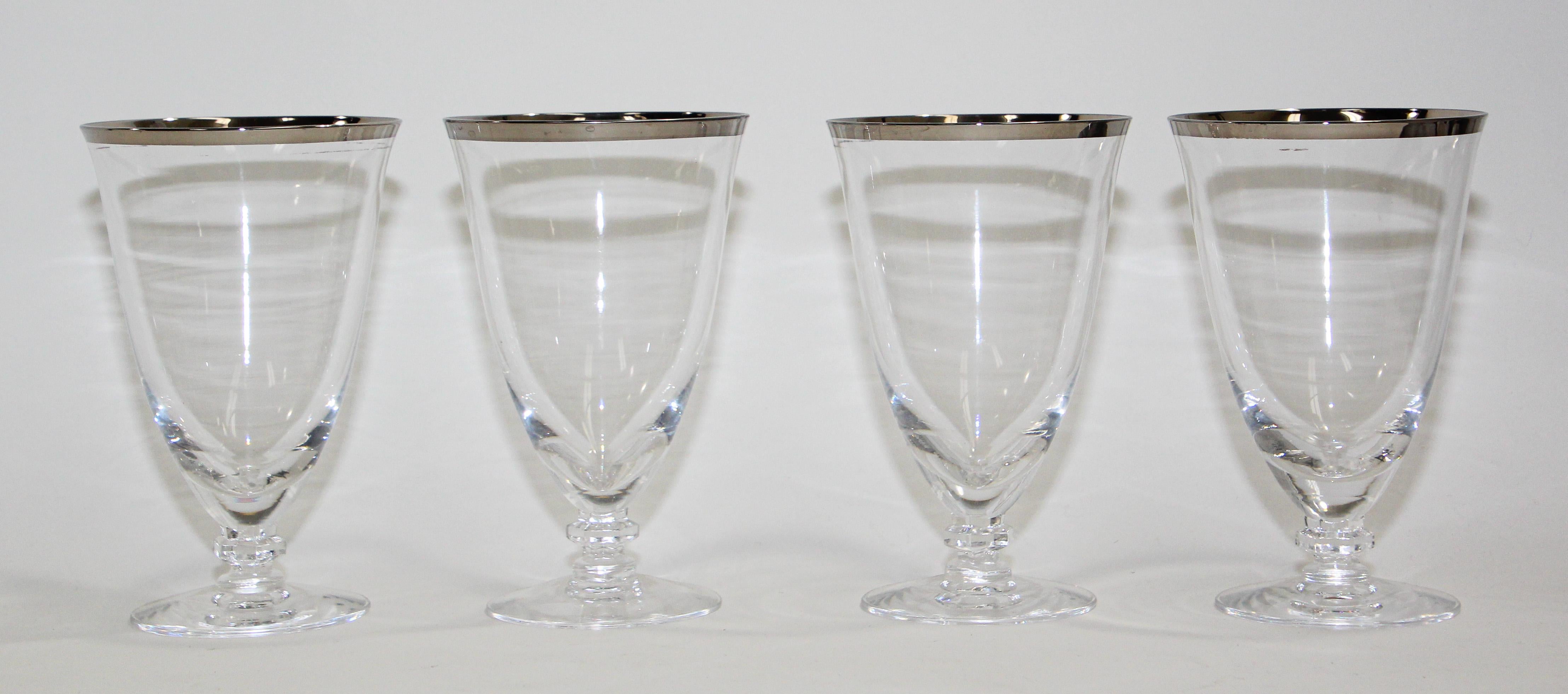 Vintage Crystal footed drinking glasses, goblets.
Crystal glasses with platinum silver rim. 
These crystal champagne glasses are a versatile home bar essential and, classic set serves today's favorite beverage, can be used as cocktail glasses,