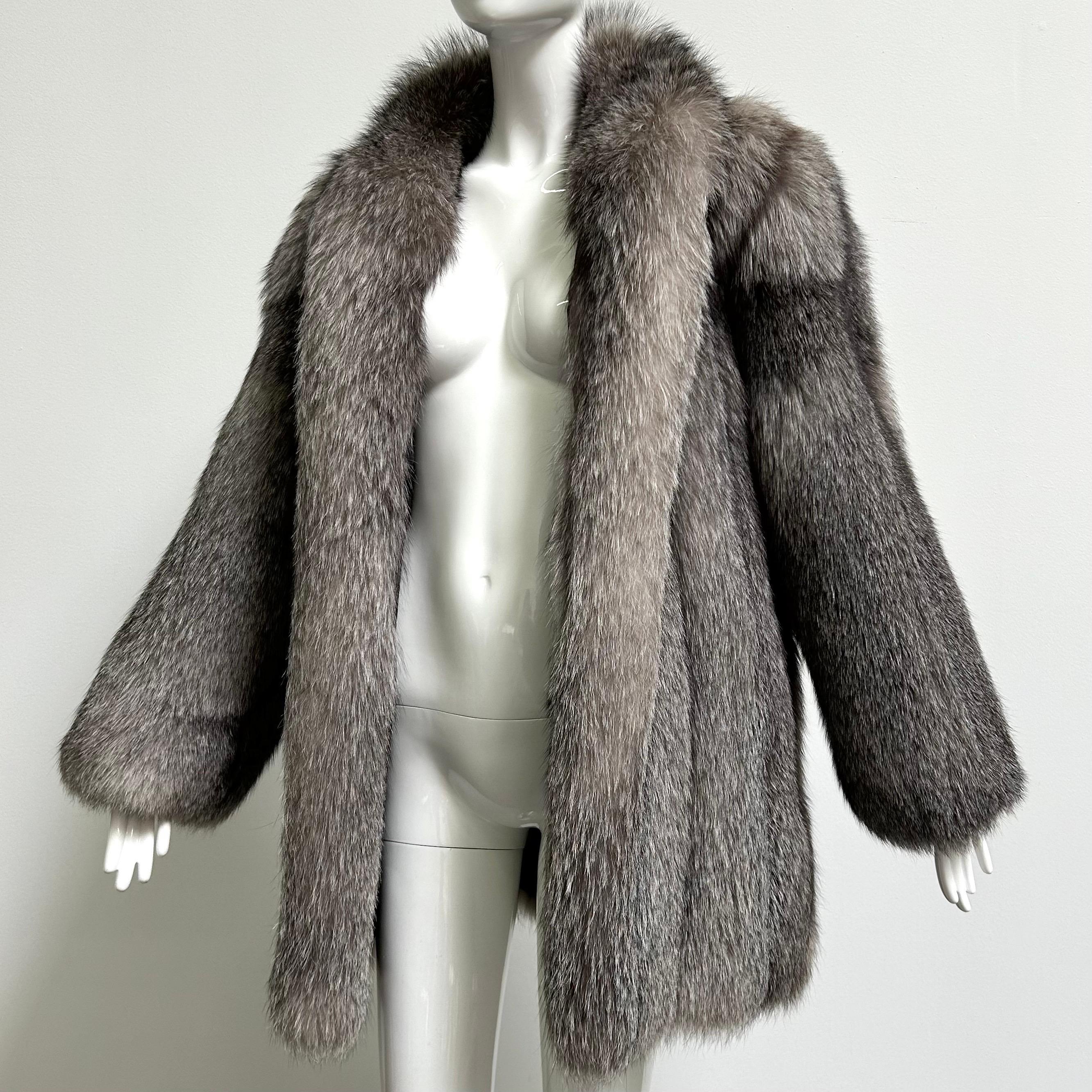 Stunning vintage crystal fox fur coat in a size large. Fully lined with monogram and velvet lined pockets. Excellent vintage condition with no noted flaws. The bust measures 42