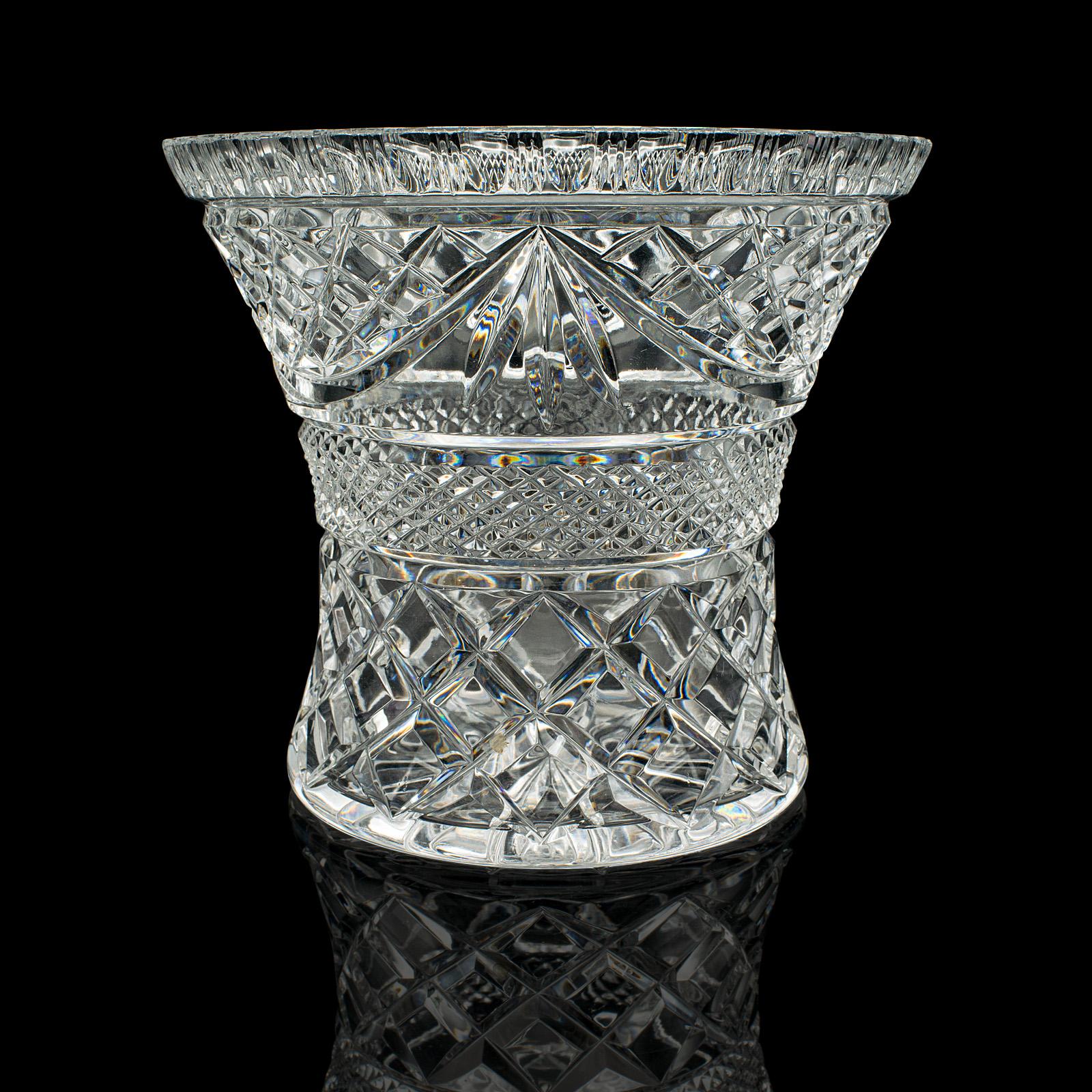 
This is a vintage crystal ice bucket. An English, cut crystal glass bottle cooler, dating to the mid 20th century, circa 1950.

Superb cut glass appearance - ideal for cooling a standard size bottle
Displaying a desirable aged patina and in good