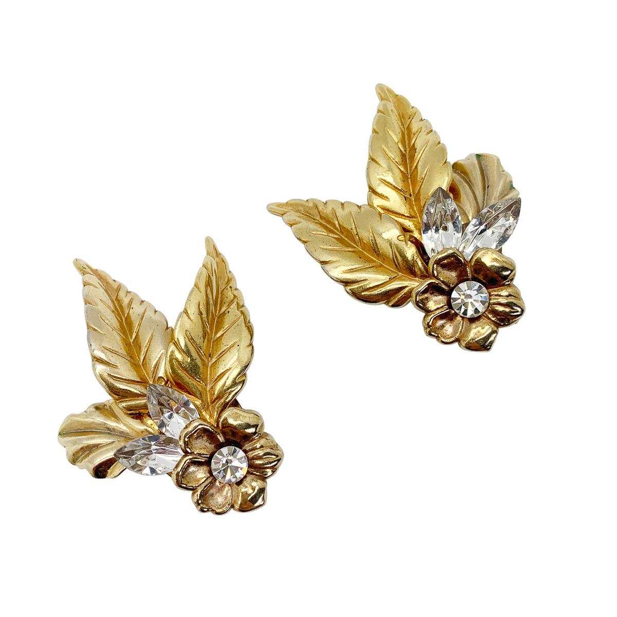 Fabulous Vintage Crystal Leaf Earrings featuring the gorgeous detailing and finished with marquise and chaton crystals. A stunning vintage earring that will give you heritage style with a modern and edgy vibe.

Vintage Condition: Very good without
