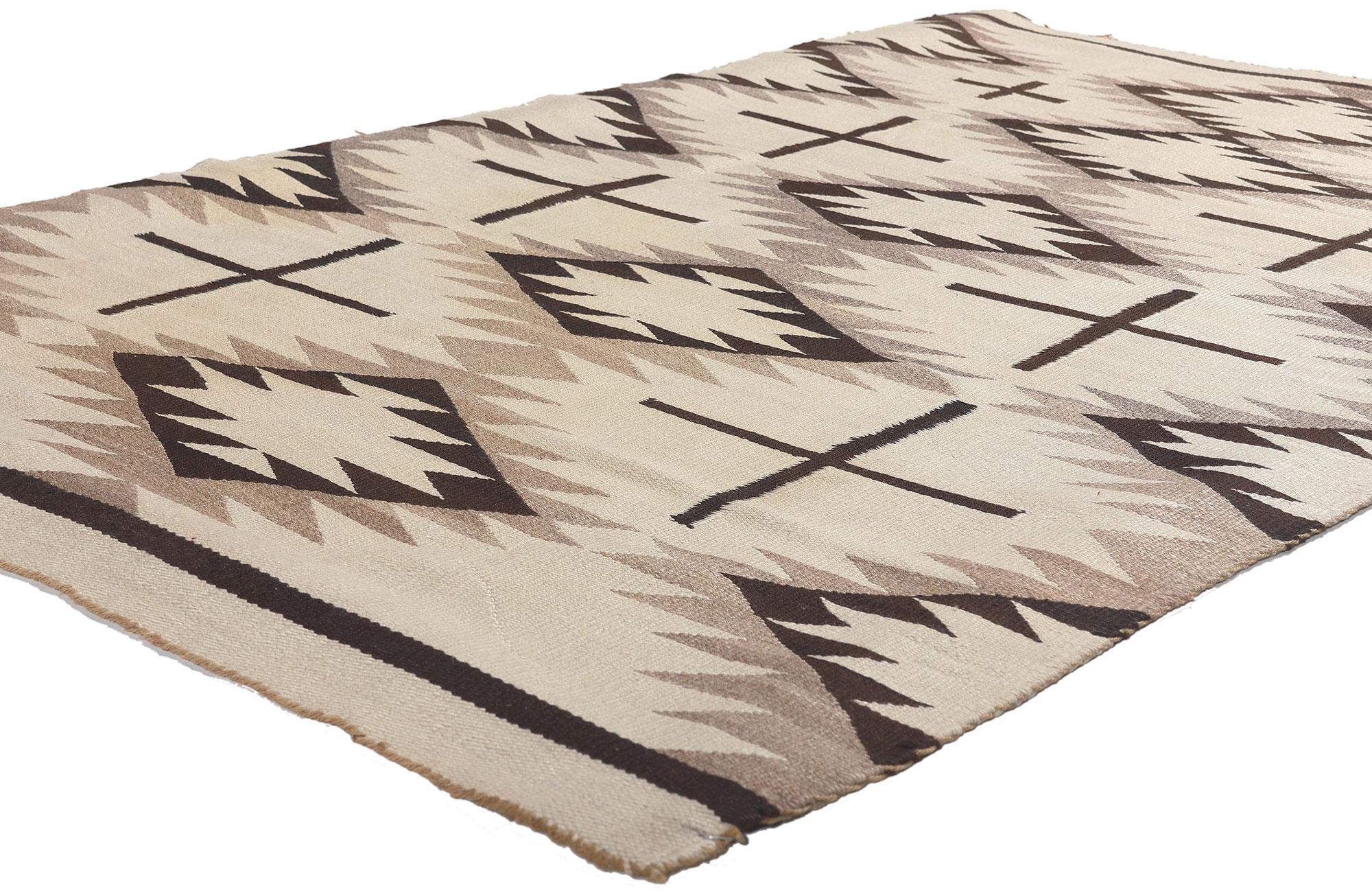 78611 Antique Neutral Crystal Navajo Rug, 03'09 x 05'10.
Emanating Native American style with incredible detail and texture, this handwoven Crystal Navajo rug is a captivating vision of woven beauty. The eye-catching geometric design and neutral