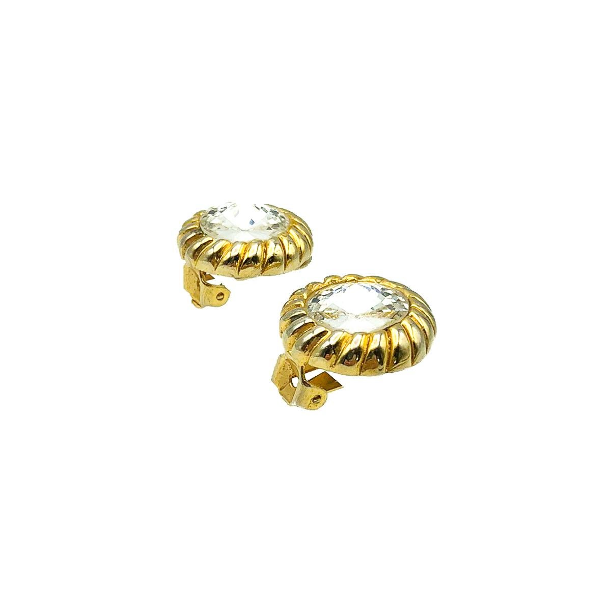 A divine pair of vintage Crystal Rivoli Earrings. Featuring a large clear rivoli crystal within a deep gold edged setting providing a glorious contrast and finish. 
Vintage Condition: Very good without damage or noteworthy wear. 
Materials: Gold