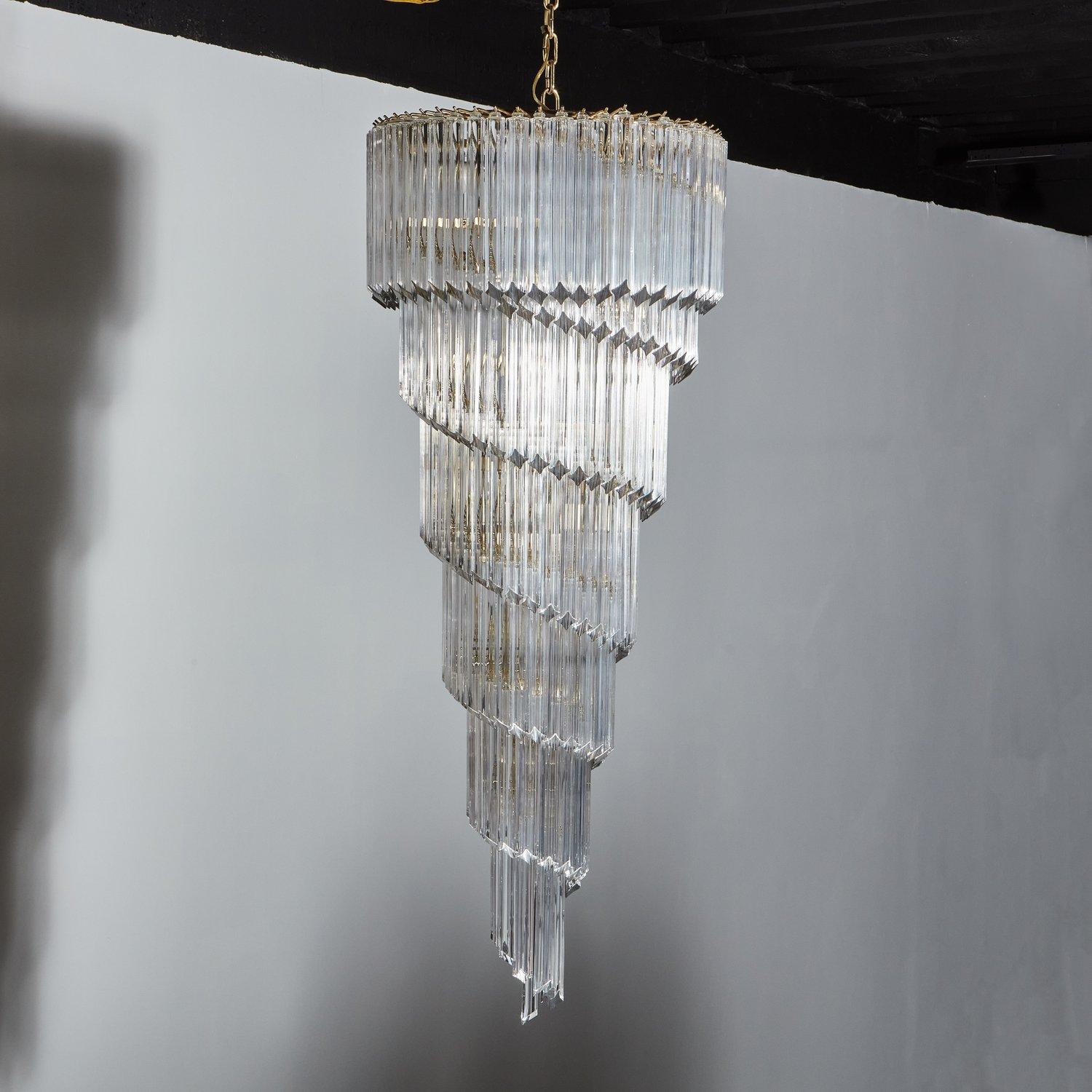 A stunning Venini style chandelier featuring over 150 hand blown Murano glass prisms hanging in a spiral form from a beautiful polished brass frame. Italy, 1970s.