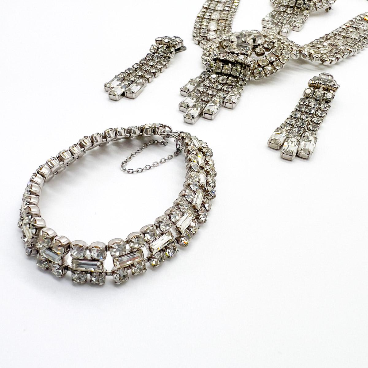 A fabulous and very grand vintage crystal tassel parure from the 1950s. Comprising a full compliment of four pieces. Think cocktails, think parties and glamour. The vast array of stones, including fancy cut baguette crystals and chatons in varying