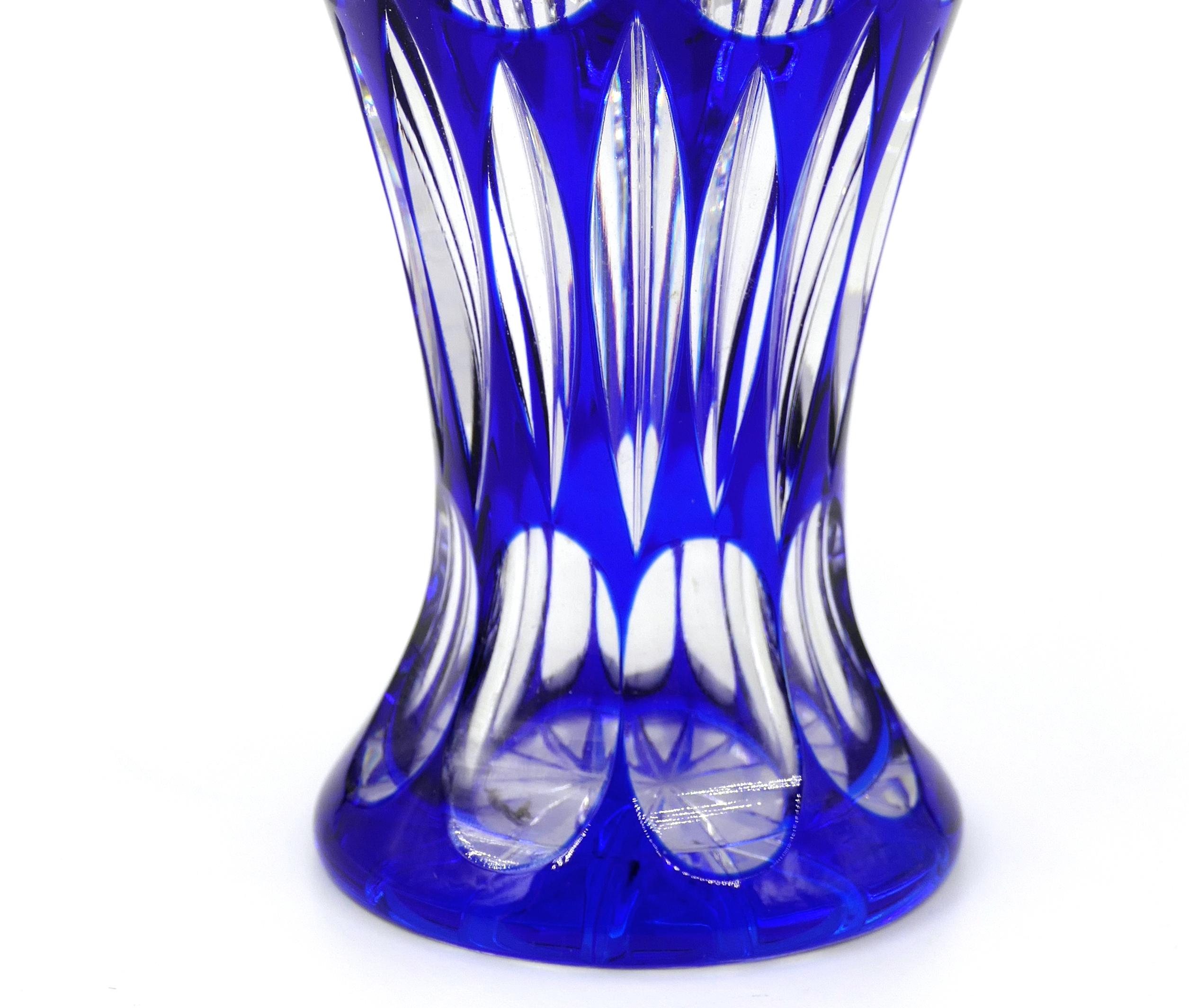 This is a crystal vase, produced in the second half of 20th century.

Probably it deals with a fine Bavarian crystal produced by Nachtmann.

In excellent condition, this precious cobalt blue crystal vase with a transparent geometric motive