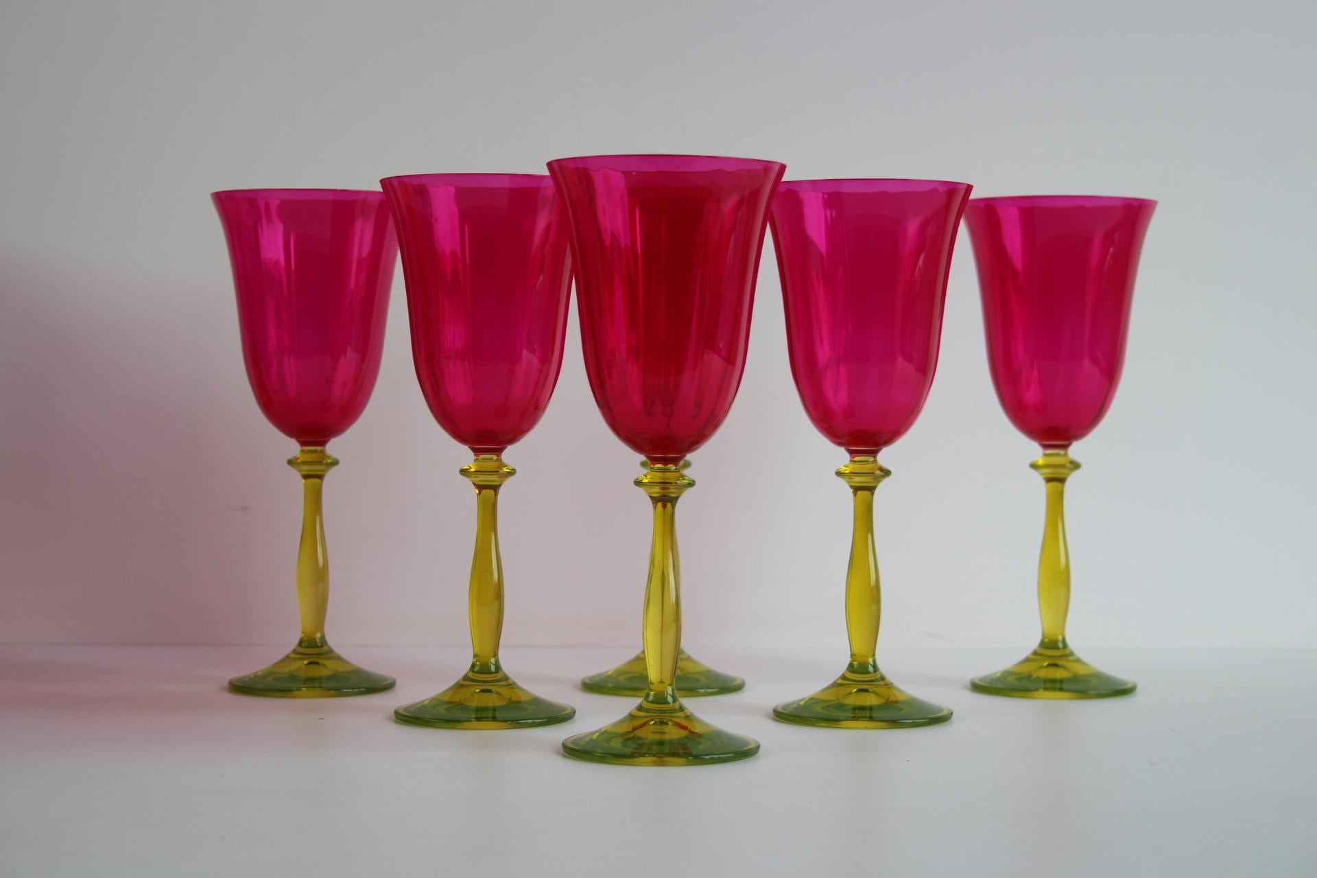 Add a bold splash of color and elegance to your collection with this stunning set of 6 vintage wine glasses by Crystalex, crafted in Czechoslovakia in the 1990s. These exquisite glasses feature vibrant ruby red bowls paired with striking green and