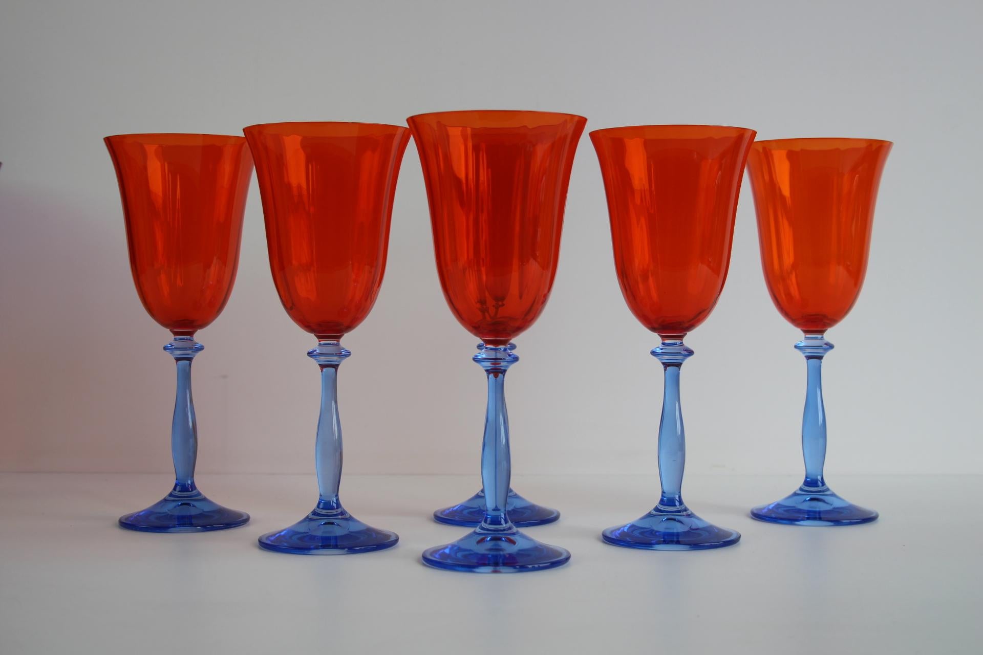 Elevate your tableware collection with this vibrant and rare set of 6 vintage wine glasses by Crystalex, crafted in Czechoslovakia around 1990. These distinctive glasses feature rich purple bowls paired with striking yellow stems, capturing the