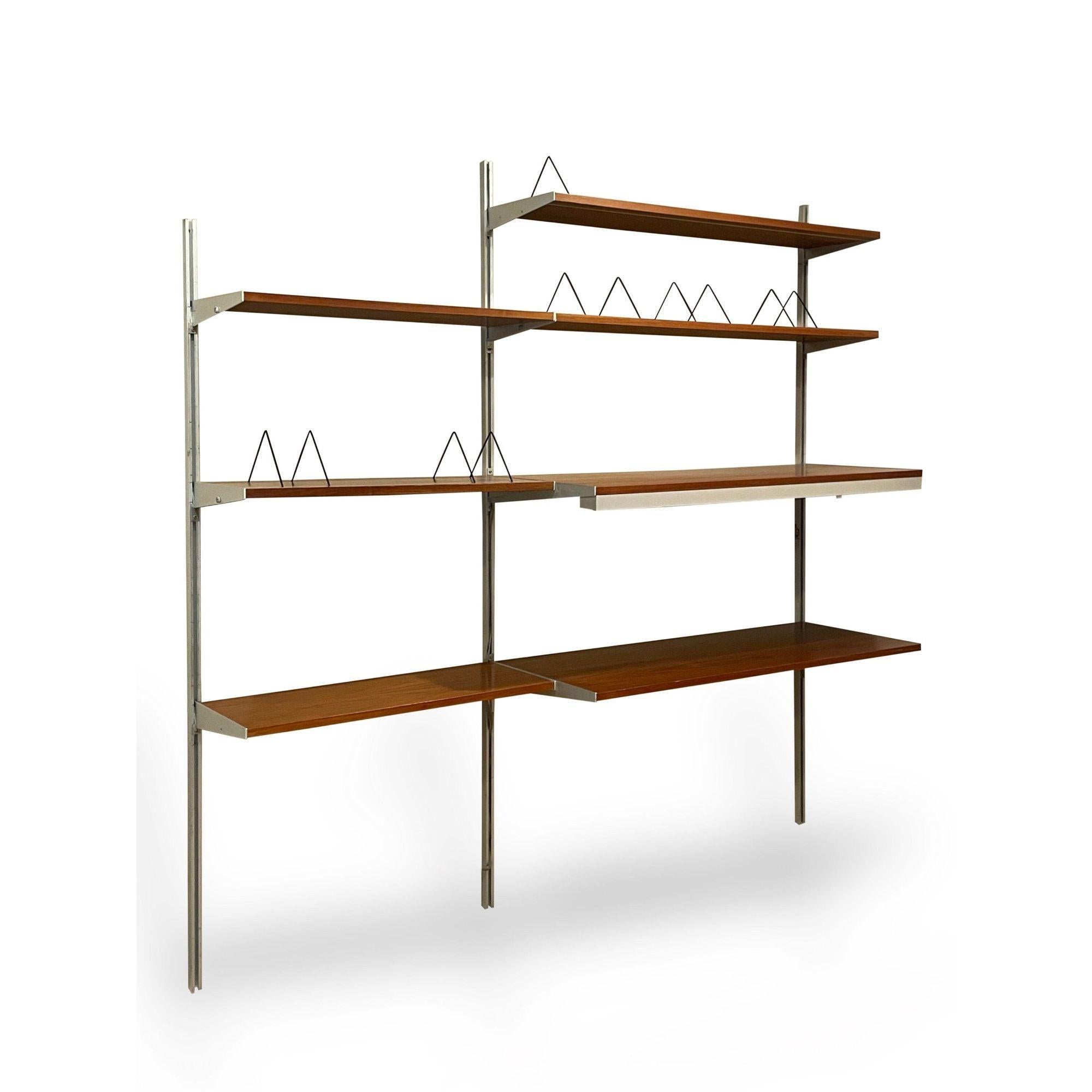 Vintage George Nelson CSS Wall Mounted Shelving Unit 1960s

CSS wall unit designed by George Nelson for Herman Miller
1960's example with two bays of shelving
Three shelves with adjustable bookends and an under mount lamp
Includes:
2 - 79.5 inch