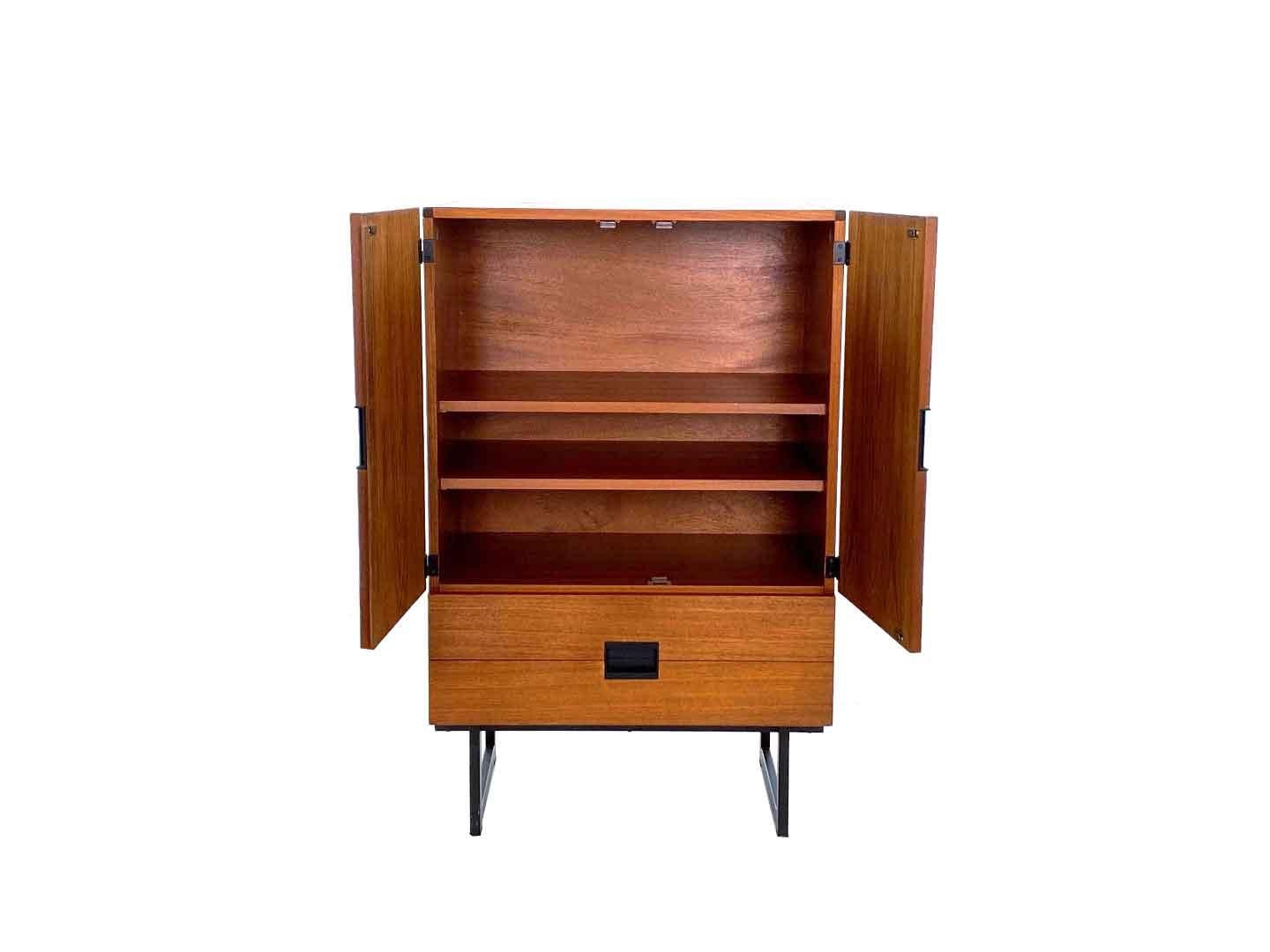 Very particularly iconic vintage CU03 cabinet by Cees Braakman, produced by Pastoe in 1958. The cabinet belongs to the Japanese series of Pastoe and is a real Dutch design classic. The cupboard has two drawers, two doors and two shelves. through the