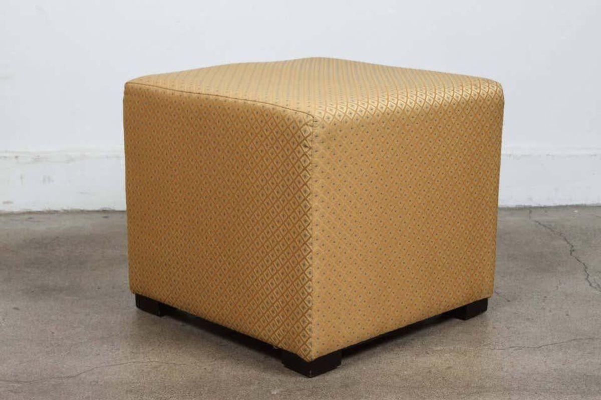 Pair of gold cube upholstery ottomans, Poufs.
Upholstered stools, use them as extra seats, ottomans, stools.
Light and easy to move around.
Moroccan hassock, upholstered footstool or ottoman.
Fabric is textured Moroccan gold with light turquoise