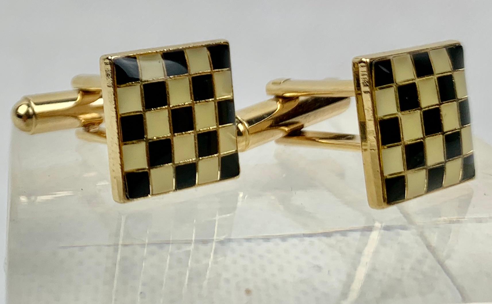 Pair of vintage gold filled cufflinks with a checkerboard pattern of black and cream high fired enamel.  The 