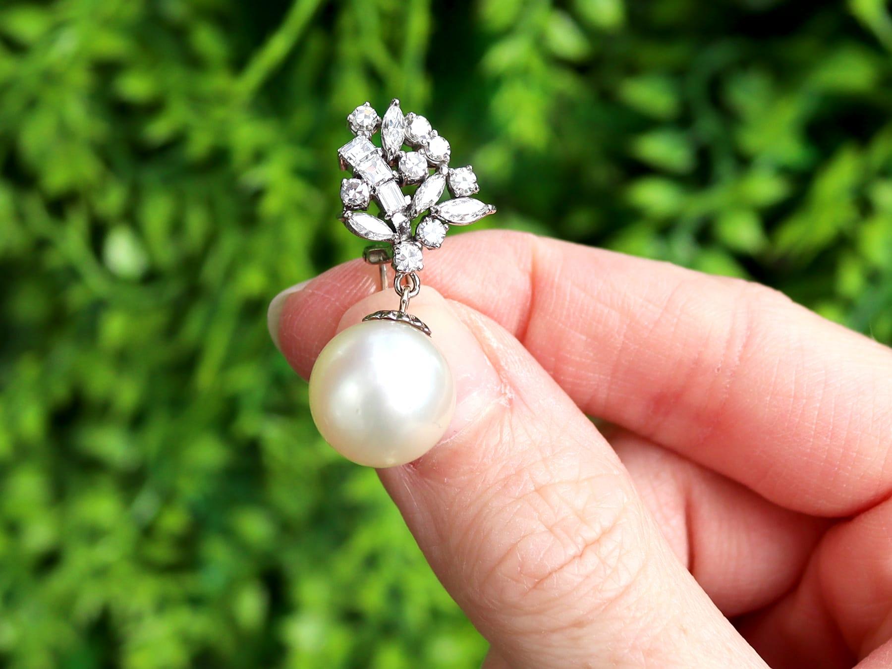 A stunning, fine and impressive pair of vintage cultured pearl and 2.84 carat diamond, 18 karat white gold and silver set earrings; part of our diverse pearl earring collections.

These stunning, fine and impressive vintage pearl earrings have been