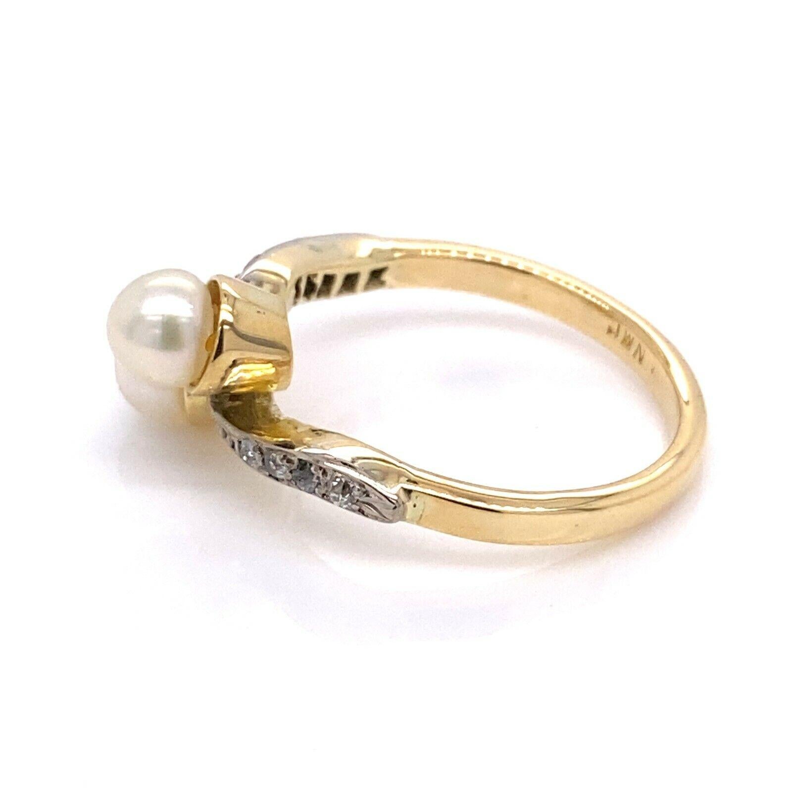 Vintage Cultured Pearl and Diamond Crossover Ring, Set In 18ct Yellow Gold Set with 0.08ct of Diamonds(4 Victorian Cut Diamonds on each Shoulder).

Additional Information:
Total Weight: 4.5g
Width of Head: 9mm
Length of Head: 21mm
Width of Band: