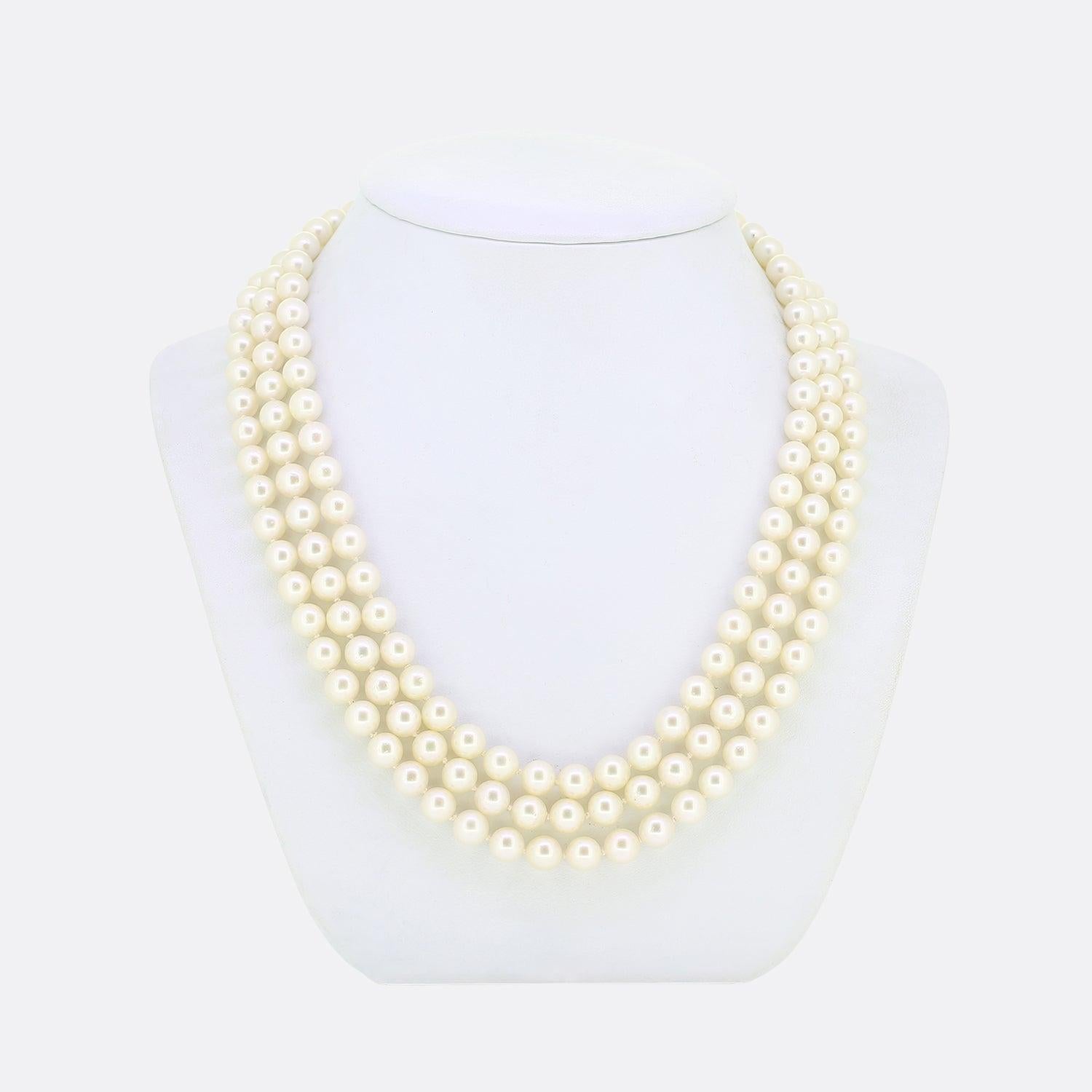 Here we have a stunning cultured pearl necklace. This vintage piece consists of three rows of individually knotted round shaped pearls; all of which are excellently matched in terms of size, presence and lustre. These wonderful stones are