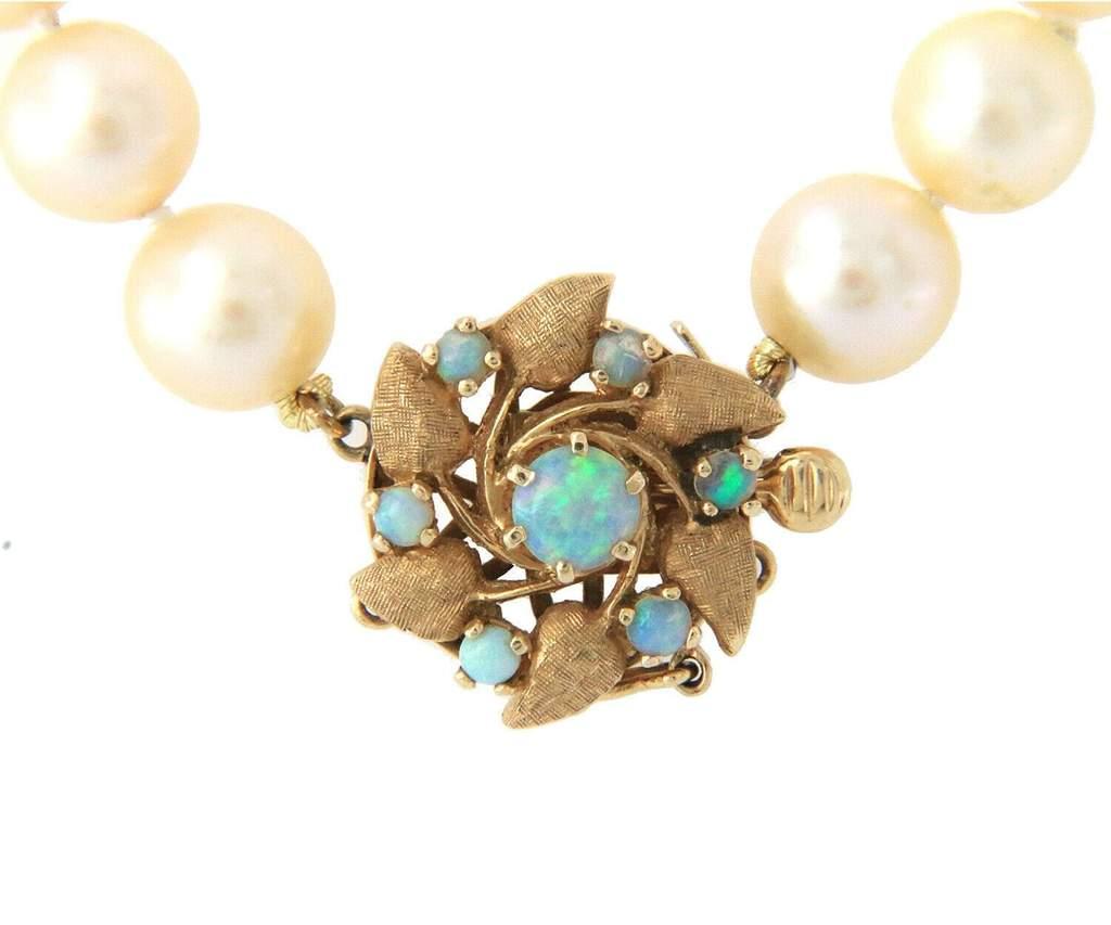 Vintage Cultured Pearl Strand Opal Flower Clasp Necklace in 14K

Vintage Cultured Pearl Strand Opal Flower Clasp Necklace
14K Yellow Gold
Pearl Sizes: Approx. 8.5 MM
Necklace Length: 16.0 Inches
Weight: Approx. 43.90 Grams
Stamped: