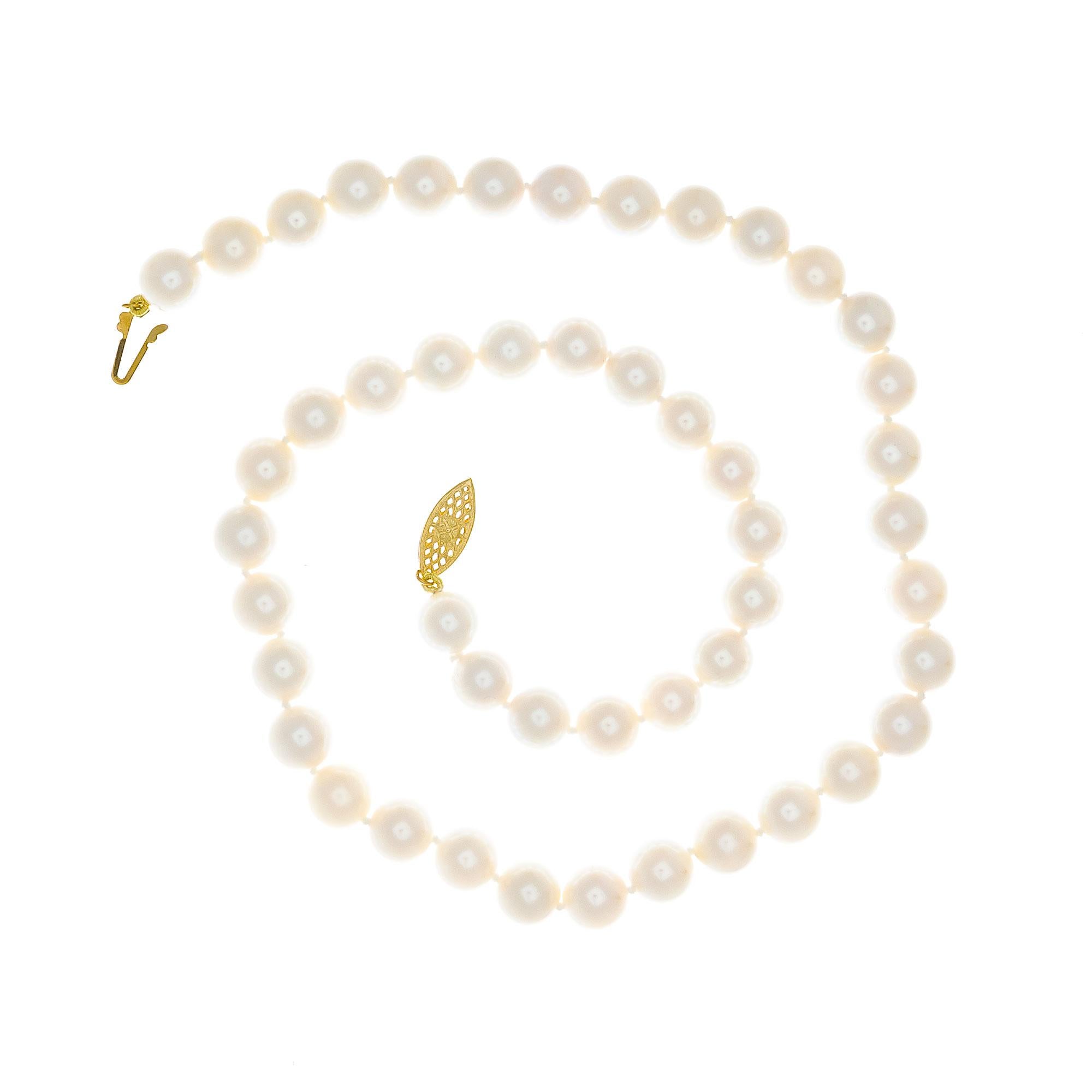 48 cultured pearl pearl necklace. White with natural cream color overtone. Very good lustre, few blemishes. Well matched pearls. 18.5 inches long. 

48 cultured white crème hues pearls, 8mm
14k yellow gold
Stamped: 14k
38.6 grams
Total length: 18.5