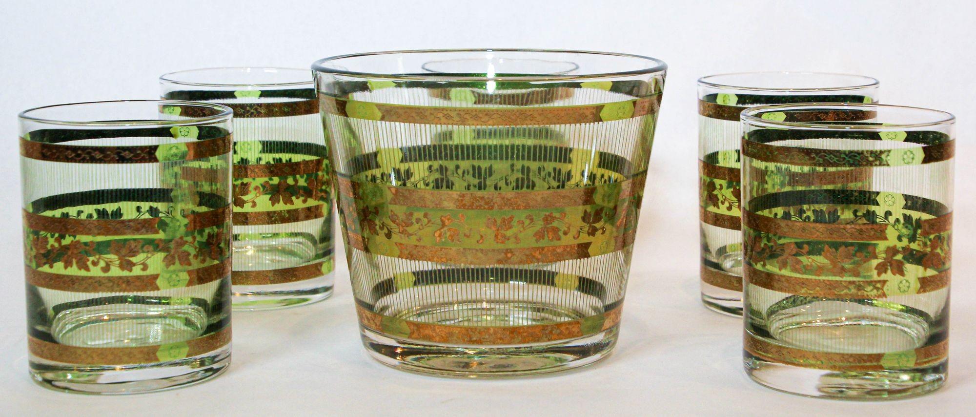 Vintage Mid-Century Modern culver Stralyte style embossed, raised, textured design on bands alternating green and gold design with leaves and 22 karat Gold Stripes set of one ice bucket and five large rock glasses.
Mid Century green and 22 Karat