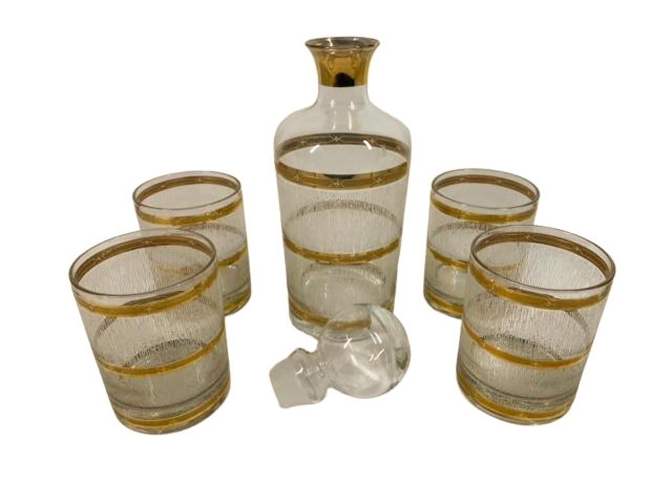 Vintage decanter and four rocks glasses by Culver LTD in the 