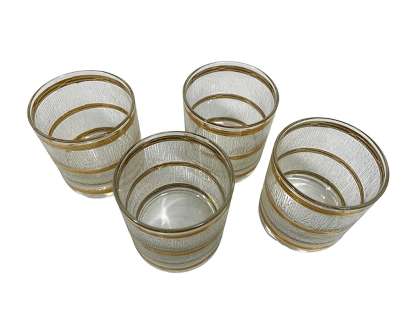 Vintage Culver LTD glasses with wide bands of raised textured bands of vertical lines of translucent white icicles between 22k gold bands with raised designs. These are a hard to find size perfect for drinking spirits 