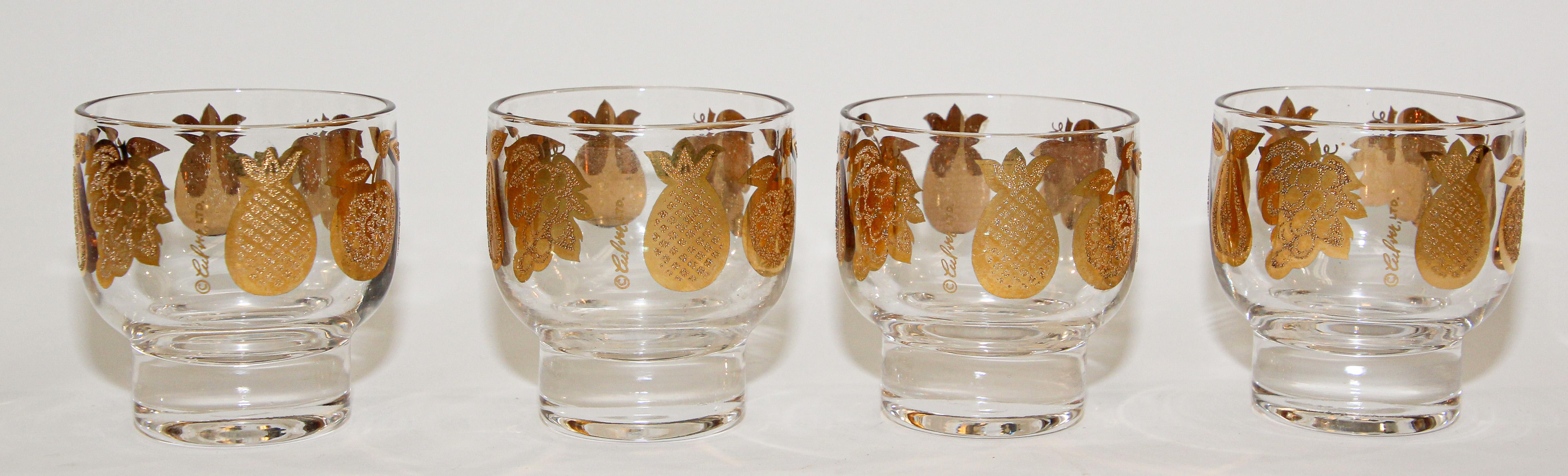 Elegant vintage midcentury Culver barware glasses with a gold leaf finish. 
Vintage Culver Florentine pattern footed cocktail glasses decorated in smooth and textured 22k gold depicting apple, pear, pineapple and grapes.
Beautiful set of 22-karat