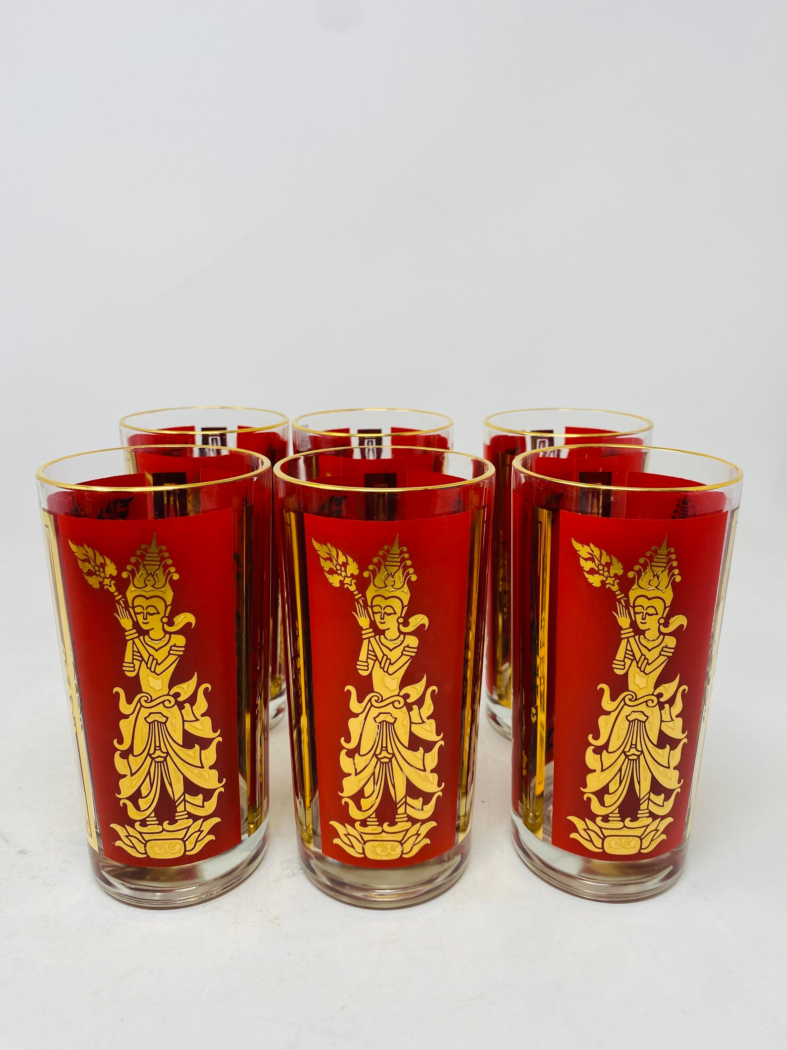Incredible and unique set. Mid-Century Modern cocktail glasses by Culver decorated with a 22 karat gold leaf design of Lakshmi. An accompanying ice bucket completes the set with the same design.  Sets like these are very few. Unique, eye-catching,