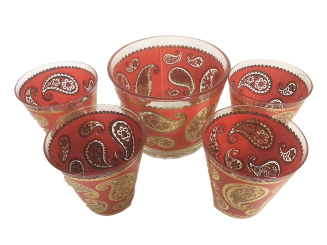 Vintage Culver red paisley ice bowl and 4 double old fashioned glasses. Decorated with paisley elements in 22k gold on a pebbled red ground.

Measures: Ice Bowl: 5