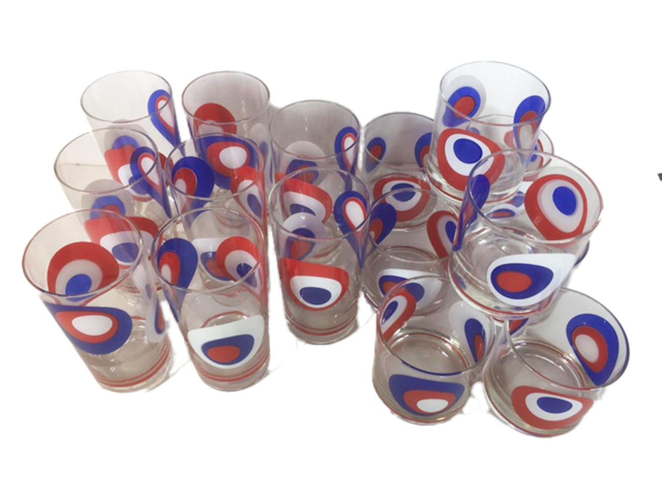 Mid-Century Modern culver barware in a red, white and blue Op-Art / Pop Art pattern each piece with red white and blue circles asymmetrically arranged on another and each in differing order. 

Measures: 8 - Highball: 5-1/2