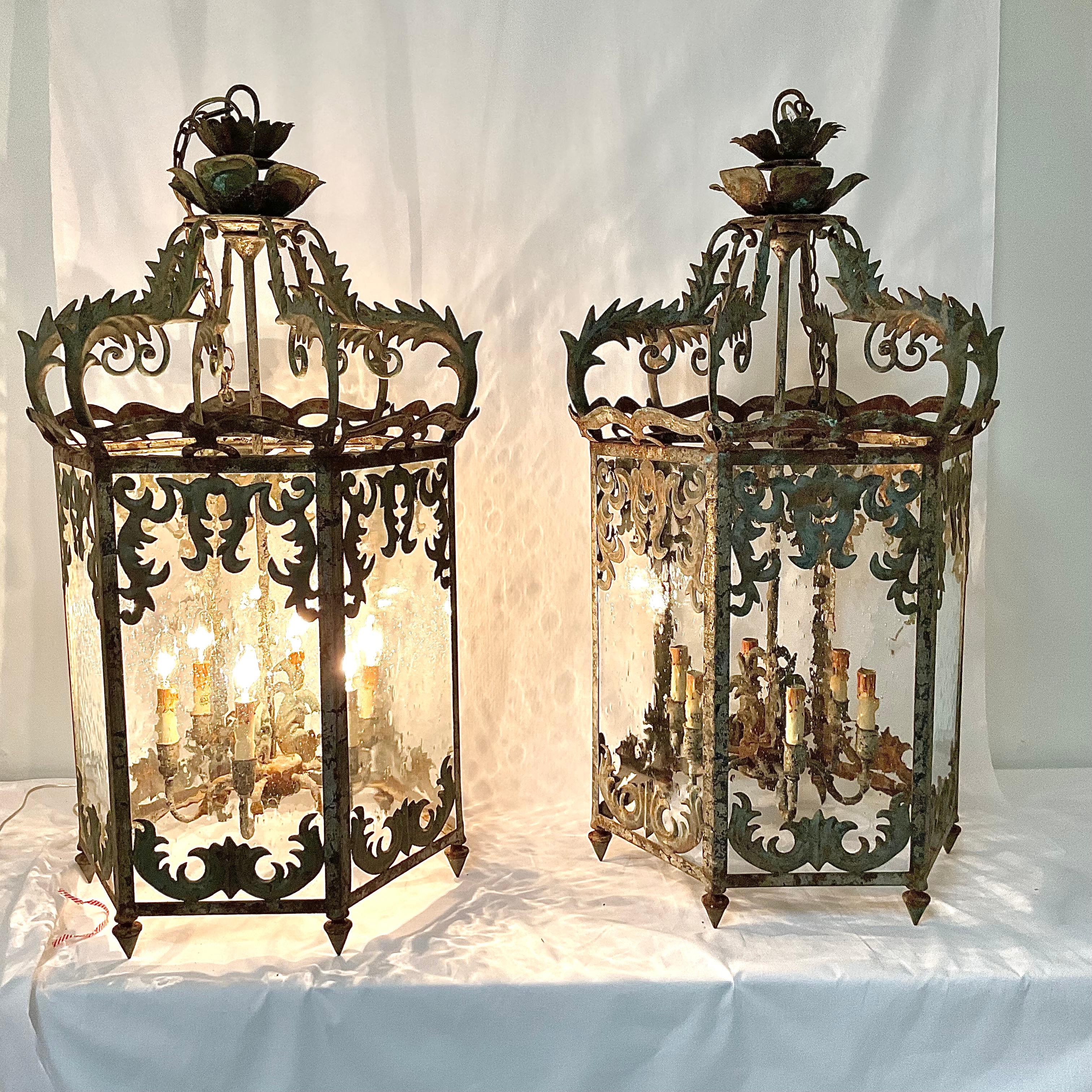Exceptional Ornate unique Curry & Company Vintage Large Lantern pair. Gorgeous seeded glass panels. Original ceiling canopy and chain. The finish is slightly distressed but beautiful. It adds to the vintage look. The detail work on this pair is