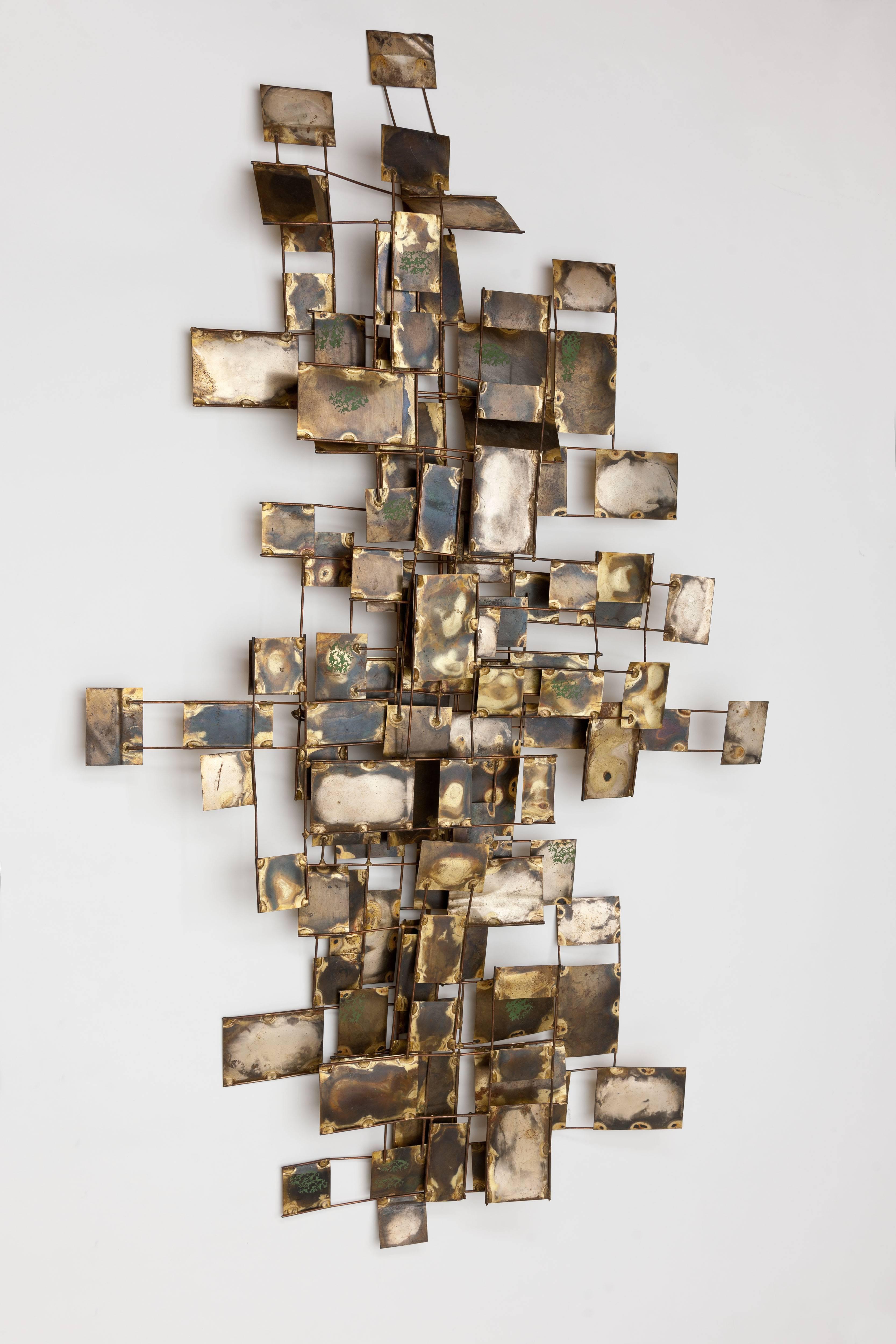 Original vintage Curtis Jere brutalist style “Labyrinth” abstract wall sculpture consisting of various metal brass elements with small green enamel detailing by Artisan House. This piece is setup to hang both horizontally and vertically on a
