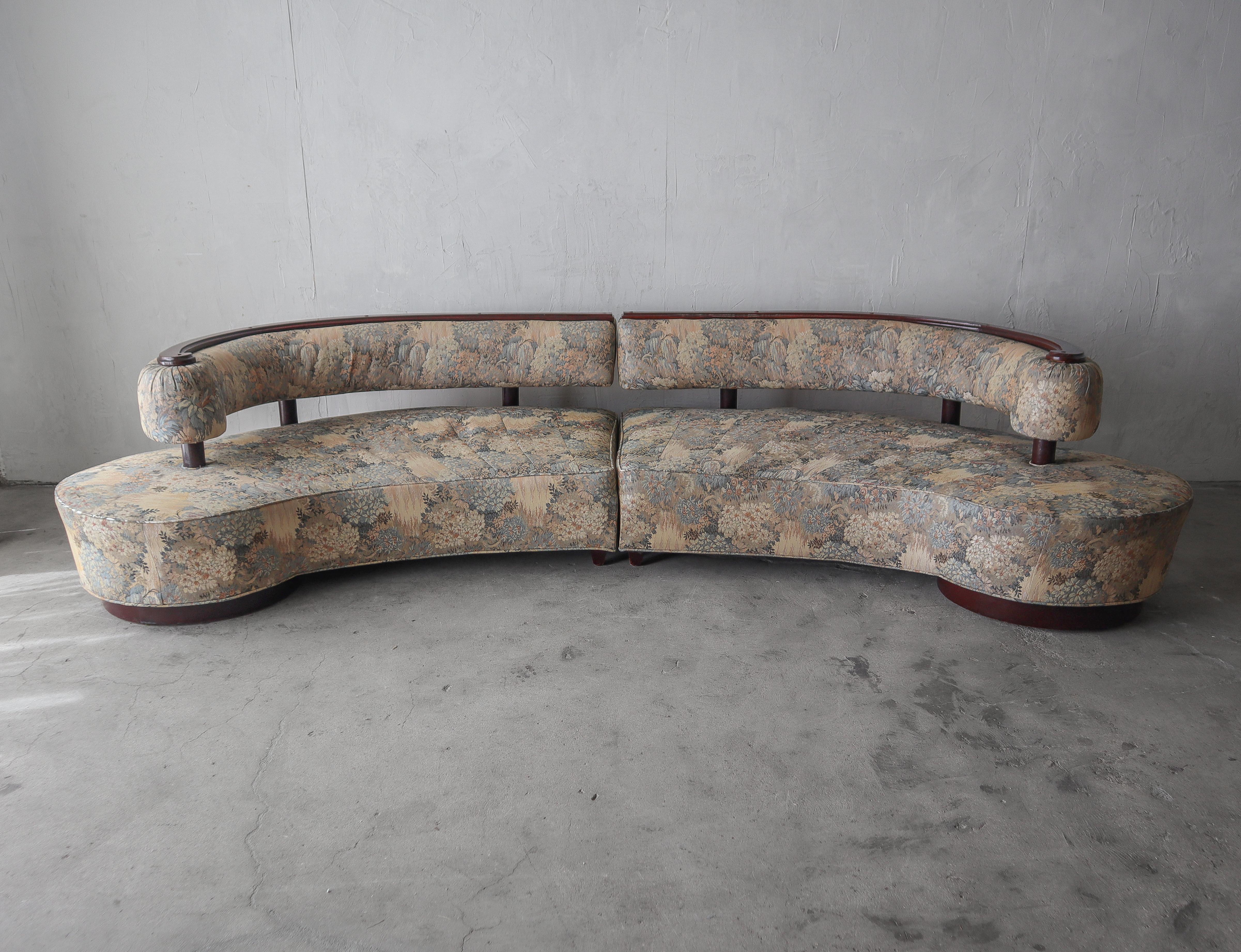 This is a stunning, never before seen, curved 2-piece mid century sectional.  This Sofa is so unique, we have never seen another and our searches are turning up empty handed.  It gives off a serpentine vibe however it is two pieces that are curved