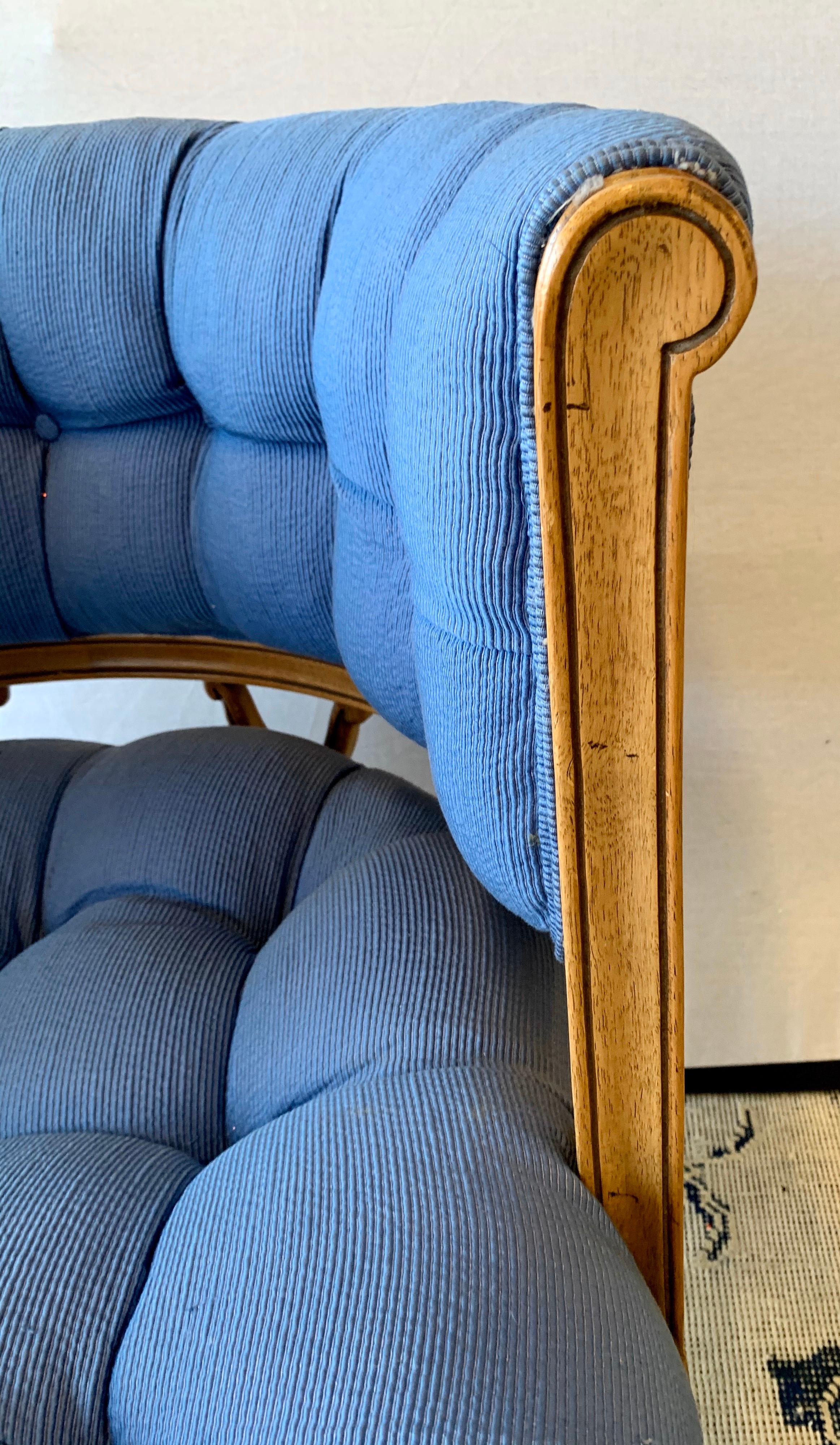 Carved tufted barrel back armchair with open trellis like details in back. Newer cotton upholstery is in the coveted 2020 blue pantone shade. The fabric has a subtle ribbed pattern.
