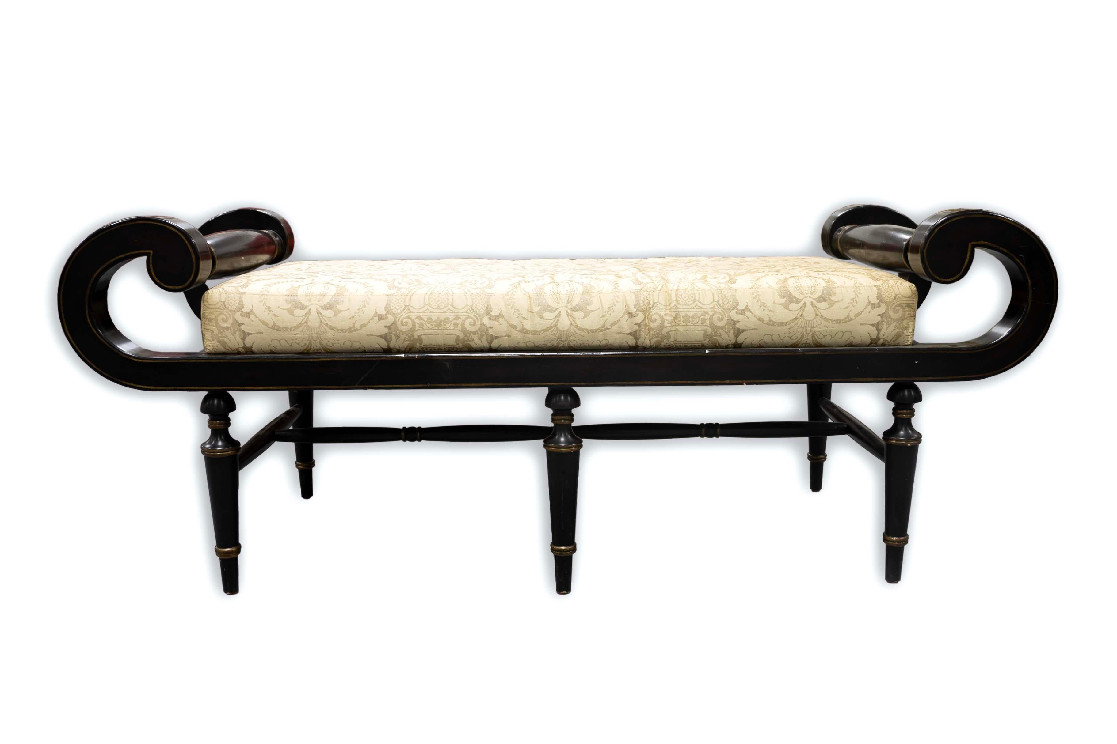 Elegant and timeless, this Vintage Curved Wood Hollywood Regency Style Cushioned Bench adds a touch of sophistication to any space. The intricate scroll arms and black lacquered finish showcase the luxurious Hollywood Regency influence, while the