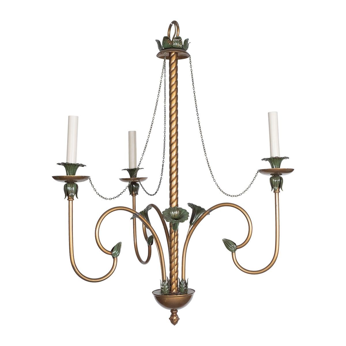 Curvilinear chandelier with gold painted metal finish featuring a verdigris floral motif.