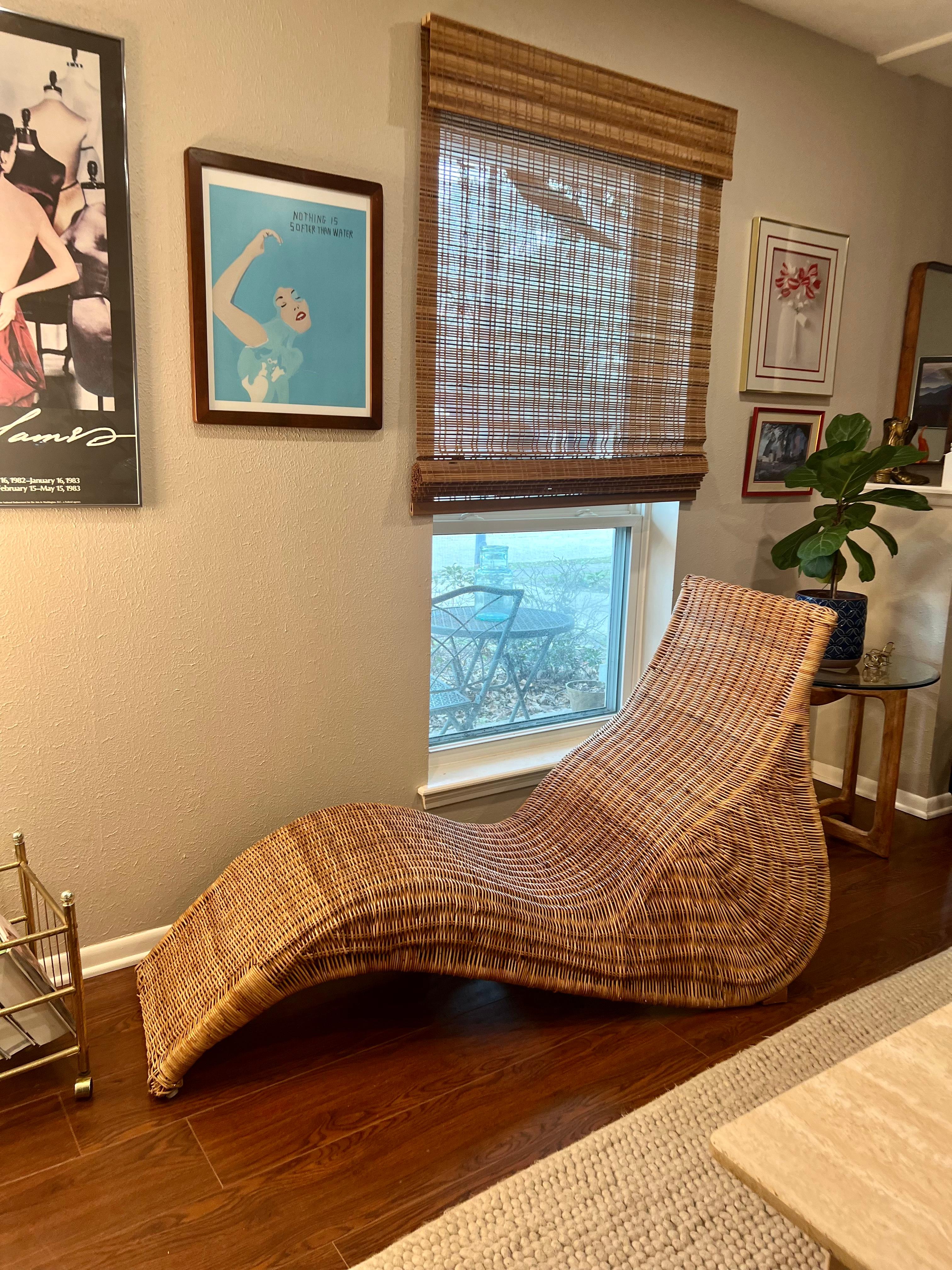 Vintage curvy Karlskrona wicker chairs lounge for ikea, circa 1990s. Features a sculptural organic form in woven wicker and bent rattan. Plastic glides in the front and angled glides in the back. The ideal place to relax. Overall in good condition.