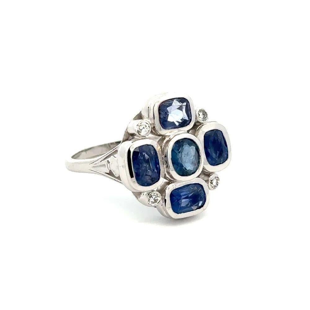 Simply Beautiful! Finely detailed Cushion Blue Sapphire and Diamond Gold Cocktail Ring. Securely nestled and Hand set with 5 Cushion Blue Sapphires, weighing approx. 4.06tcw Diamonds, accented by Diamonds, approx. .20tcw. Hand crafted 14K White Gold