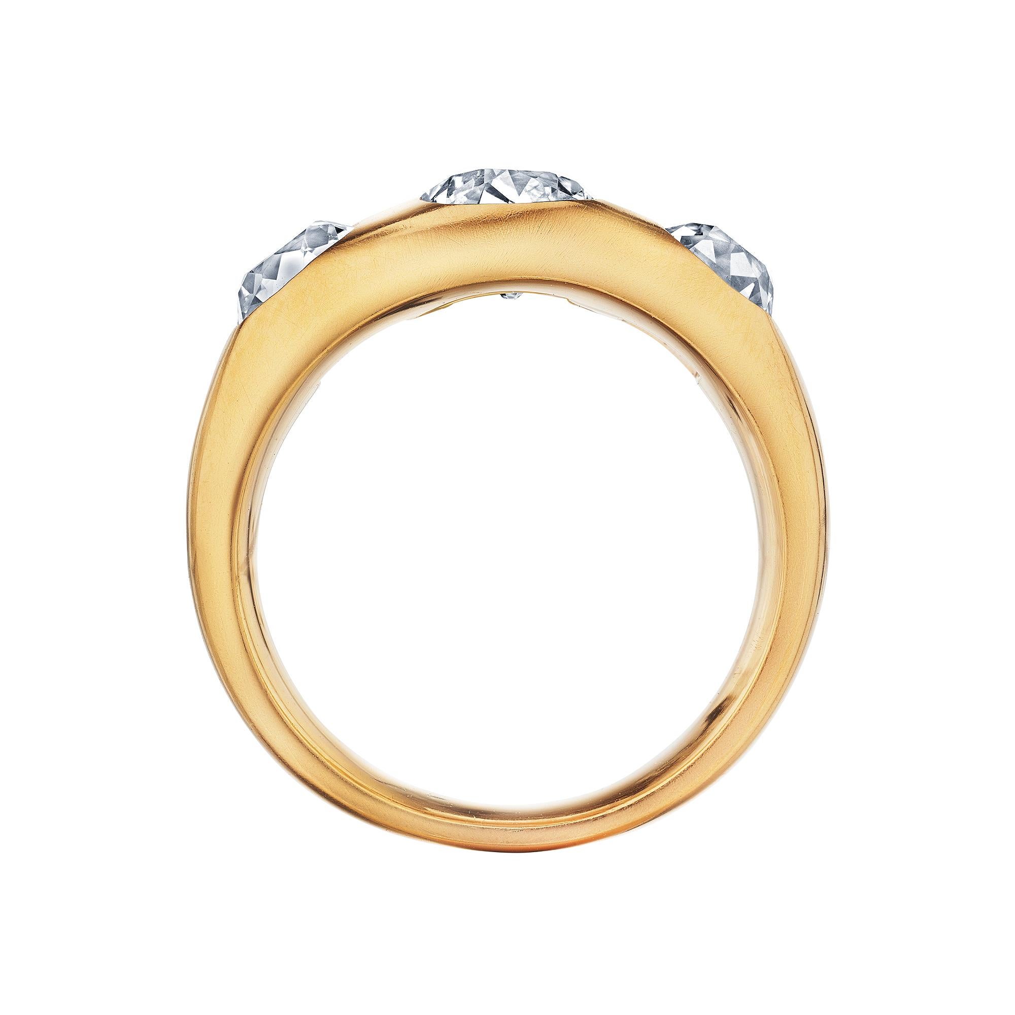 All lined up.  Three luminous vintage cushion cut diamonds, burnish set in a handmade dome style 22 karat rose gold matte finished mounting, will keep you totally aligned.  Total diamond weight 2.50 carats.  Size 6 3/4.  Can be custom sized. 