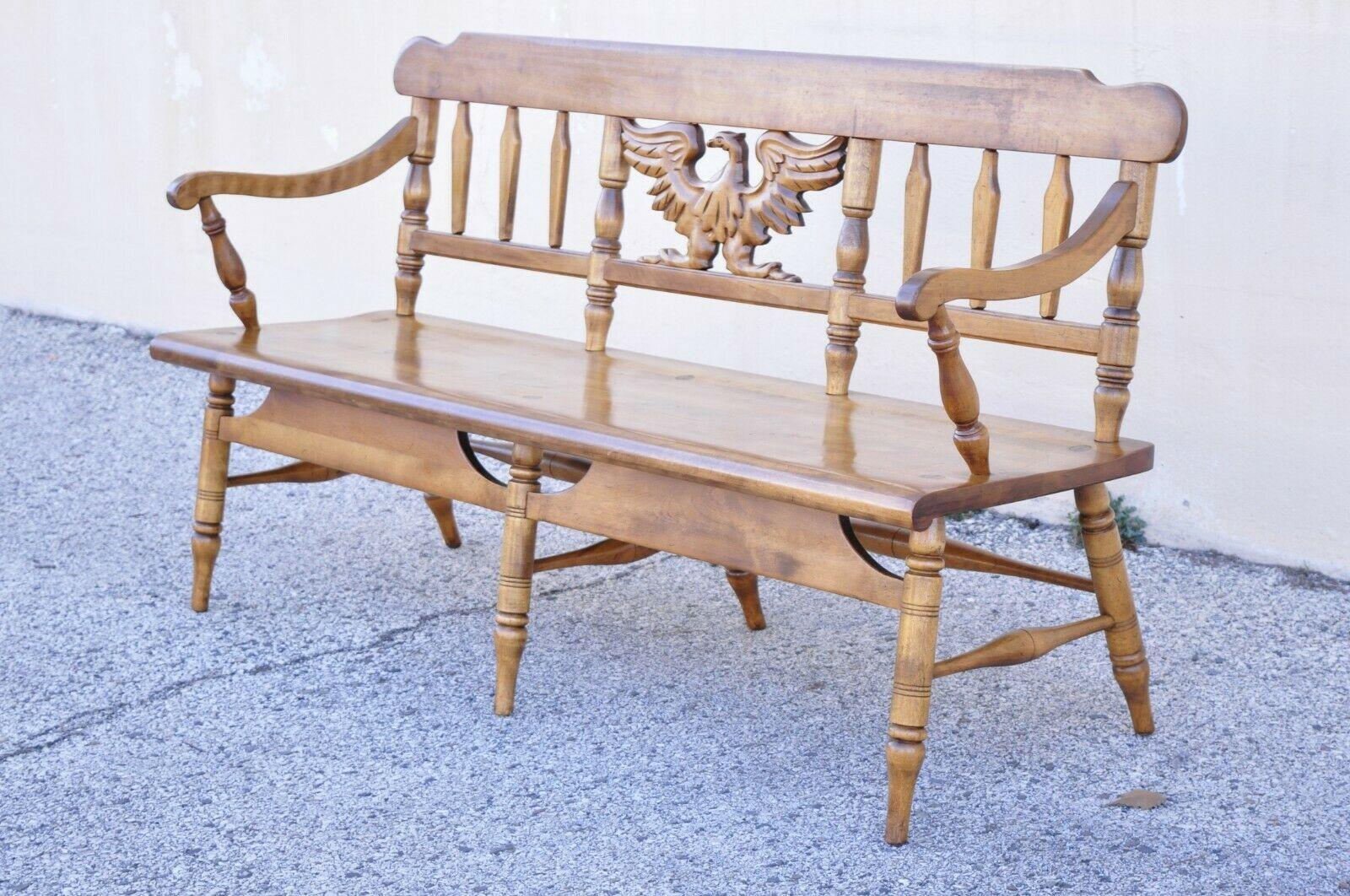 Vintage Cushman maple wood settee bench carved eagle back deacons bench. Item features a carved wood eagle, (6) turn carved legs, brass rolling casters, solid wood construction, beautiful wood grain, original label, very nice vintage item, quality