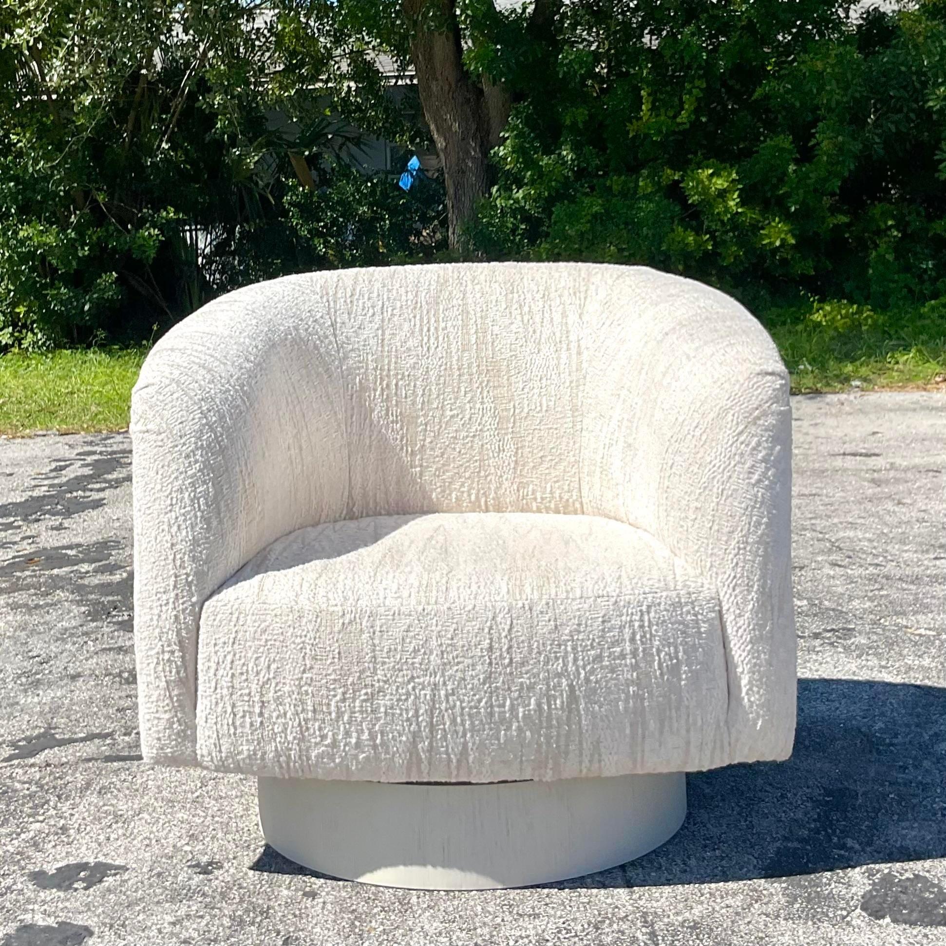 Incredible vintage custom swivel chair with a cerused white wood base and gorgeous heavy boucle fabric. Cerused wide plinth. Acquired from a Palm Beach estate. 