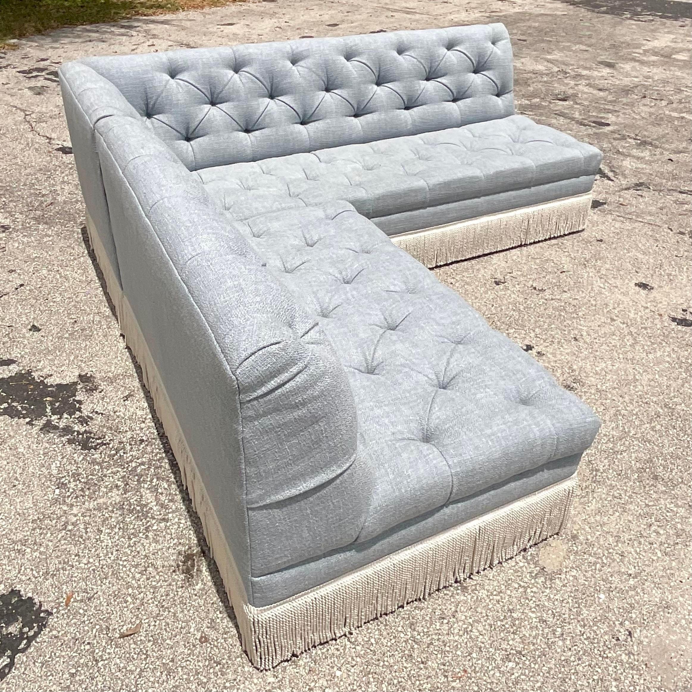 A fantastic vintage Boho sectional sofa. Custom built by the iconic OHenry group. A chic banquette sectional design in a pale blue boucle. A gorgeous heavy twist fringe along the bottom. Acquired from a Palm Beach estate.

The sofa is the same 92