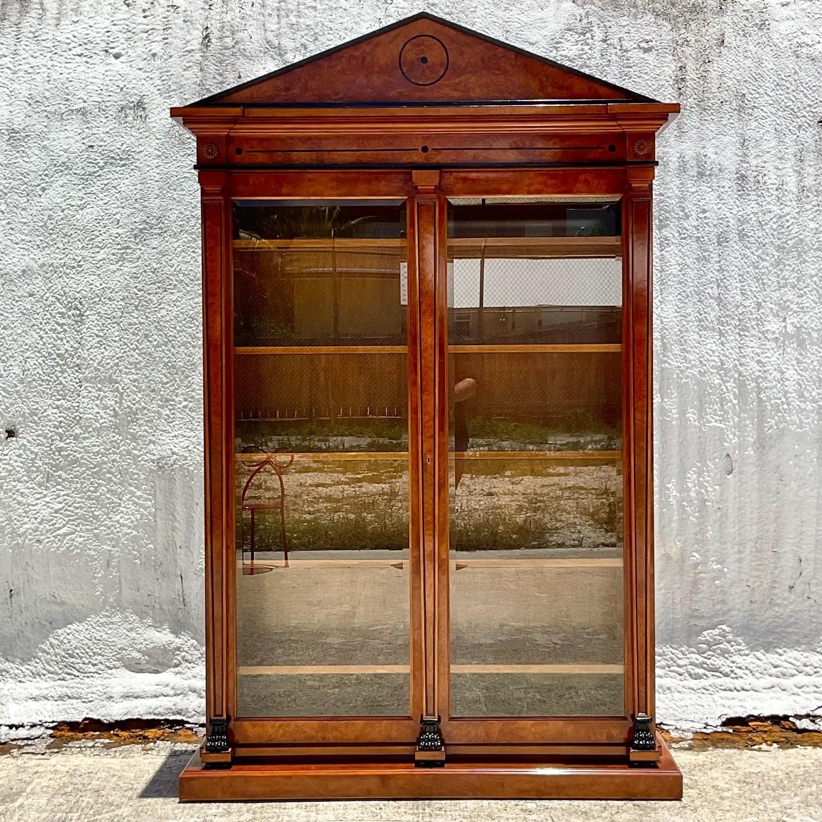 Incredible vintage custom built Bourbon cabinet. Made by the iconic KPS in Chicago. Beautiful towering pediment frame with inset glass doors and wooden shelves. Perfect for the Bourbon collector or as a home for any of your collections. A truly