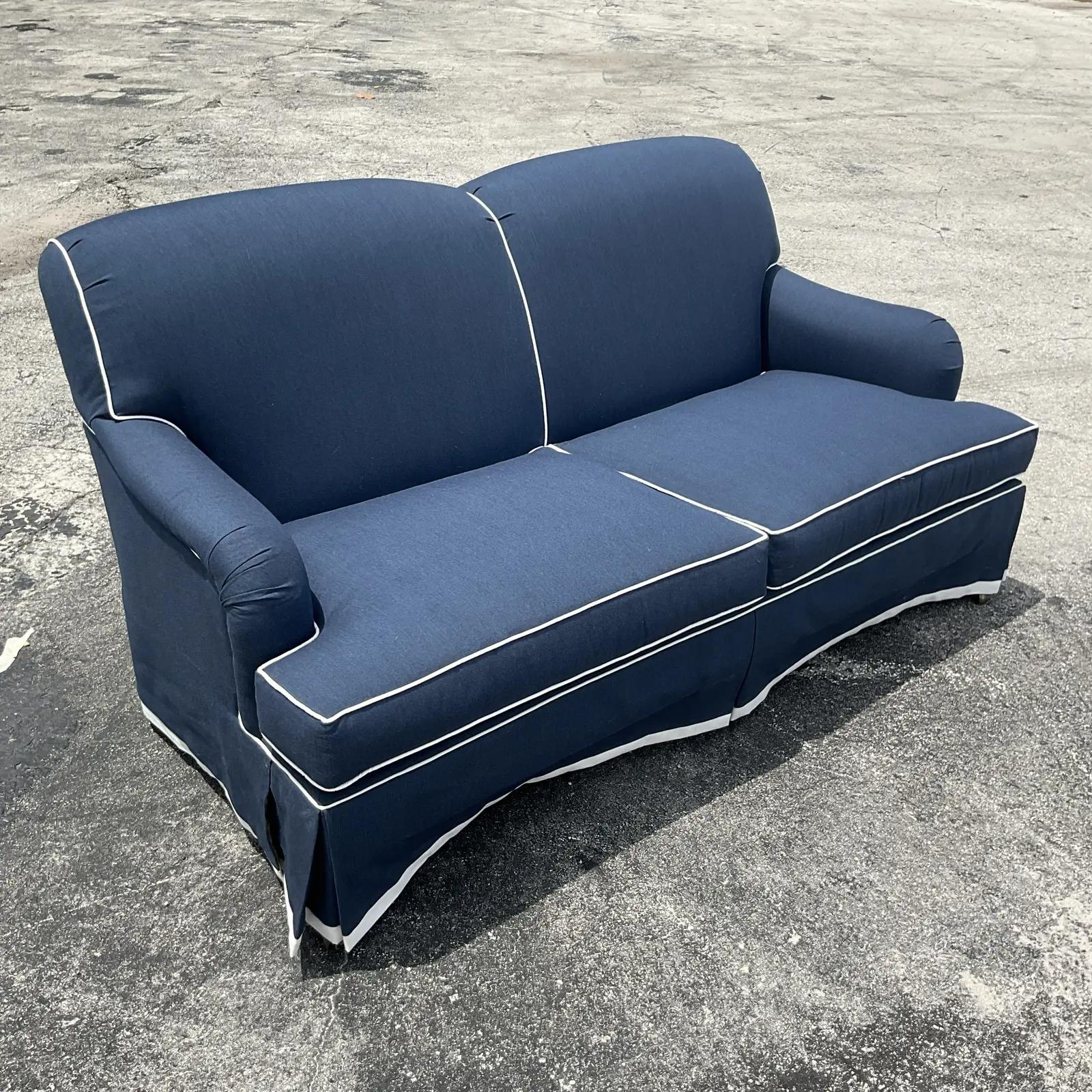 blue couch with white piping