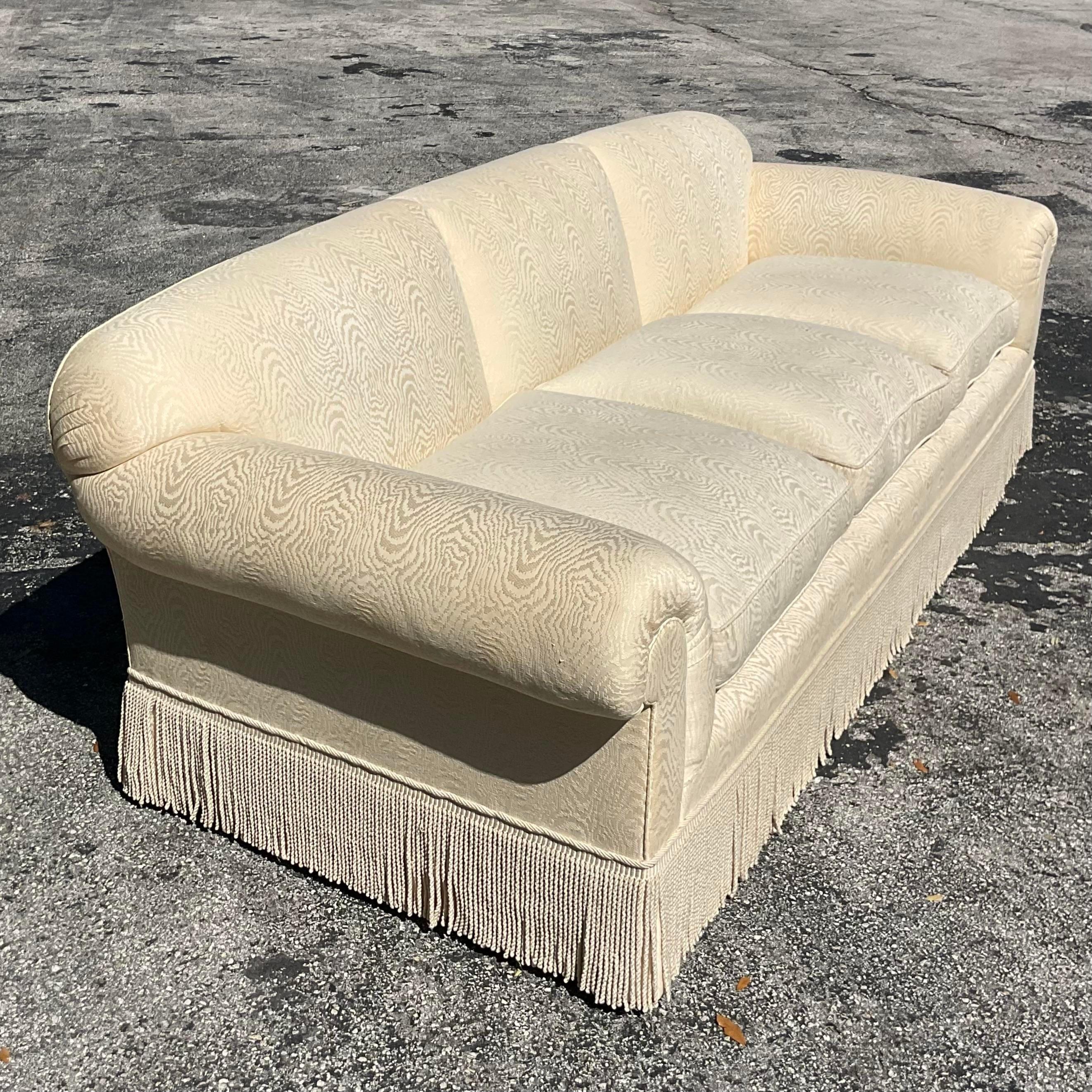 Incredible vintage custom Bunny Williams sofa with abstract wood grain damask fabric surrounded in the base with tonal twist bullion trim. Unmarked. This is a custom sofa for a private client of a bunny Williams. The entire sofa is outlined in