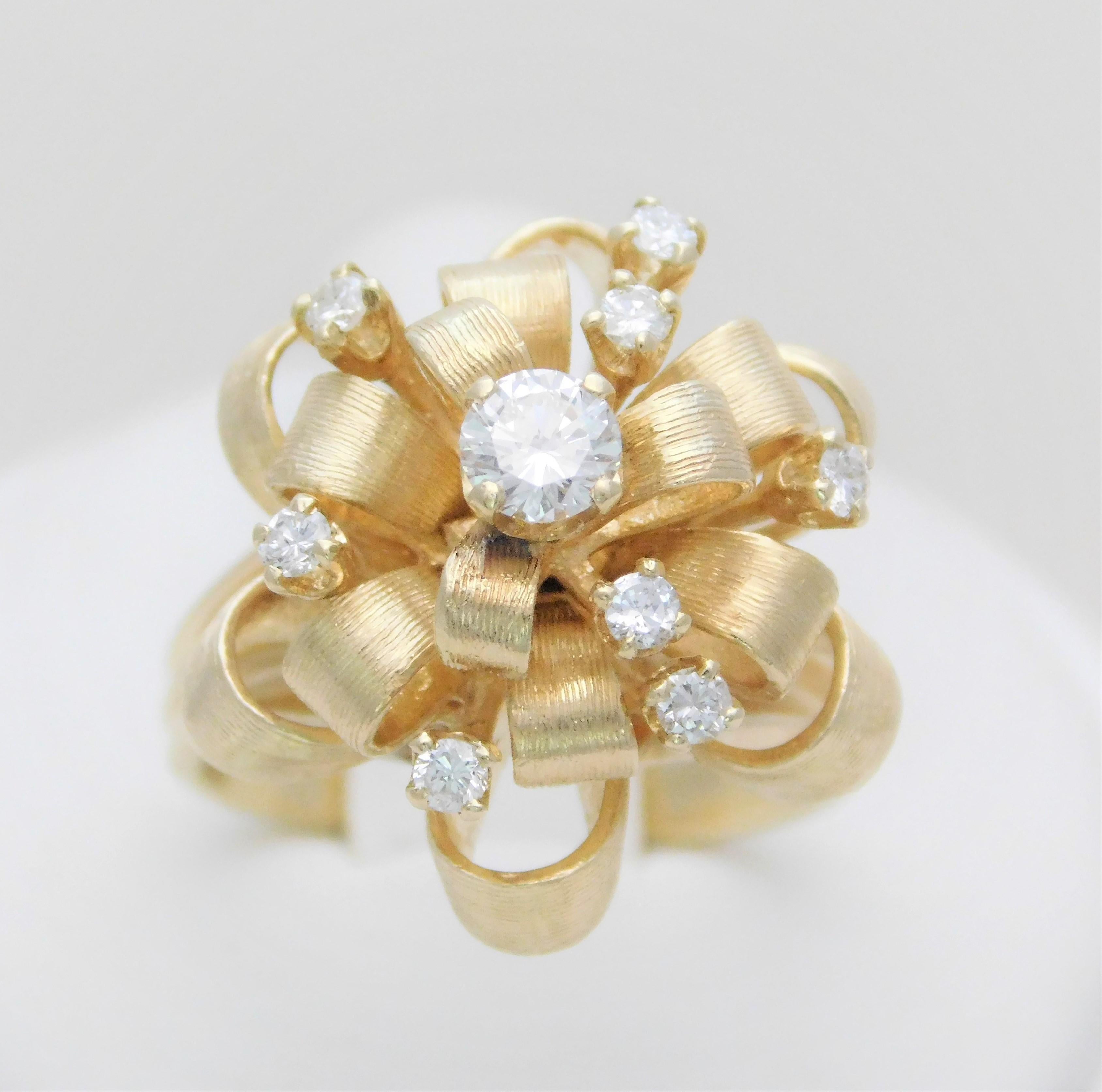 Circa 1960-1970.  From a magnificent Southern estate.  This dome-style ring has been crafted in solid 14k yellow gold.  The design is as unique as it is charming.  The extraordinary metalwork features an ornately tied solid 14k gold ribbon.  The